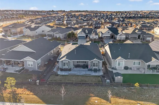 an aerial view of a house with a city view