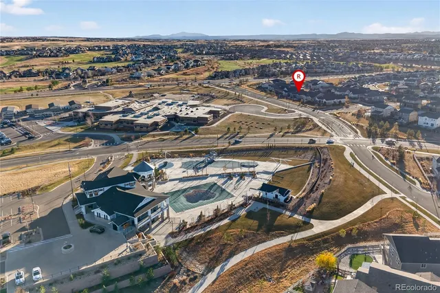 an aerial view of residential houses with outdoor space