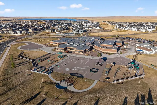an aerial view of a house with outdoor space
