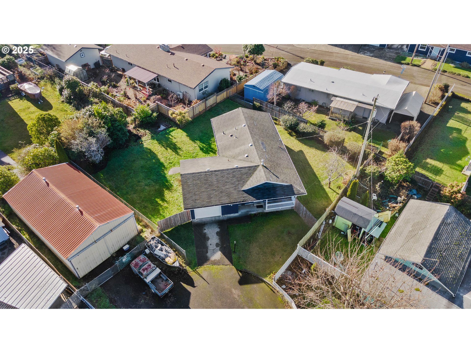 124 Holly Court Reedsport, OR 97467 - Photo 2 of 30 an aerial view of a house with a garden