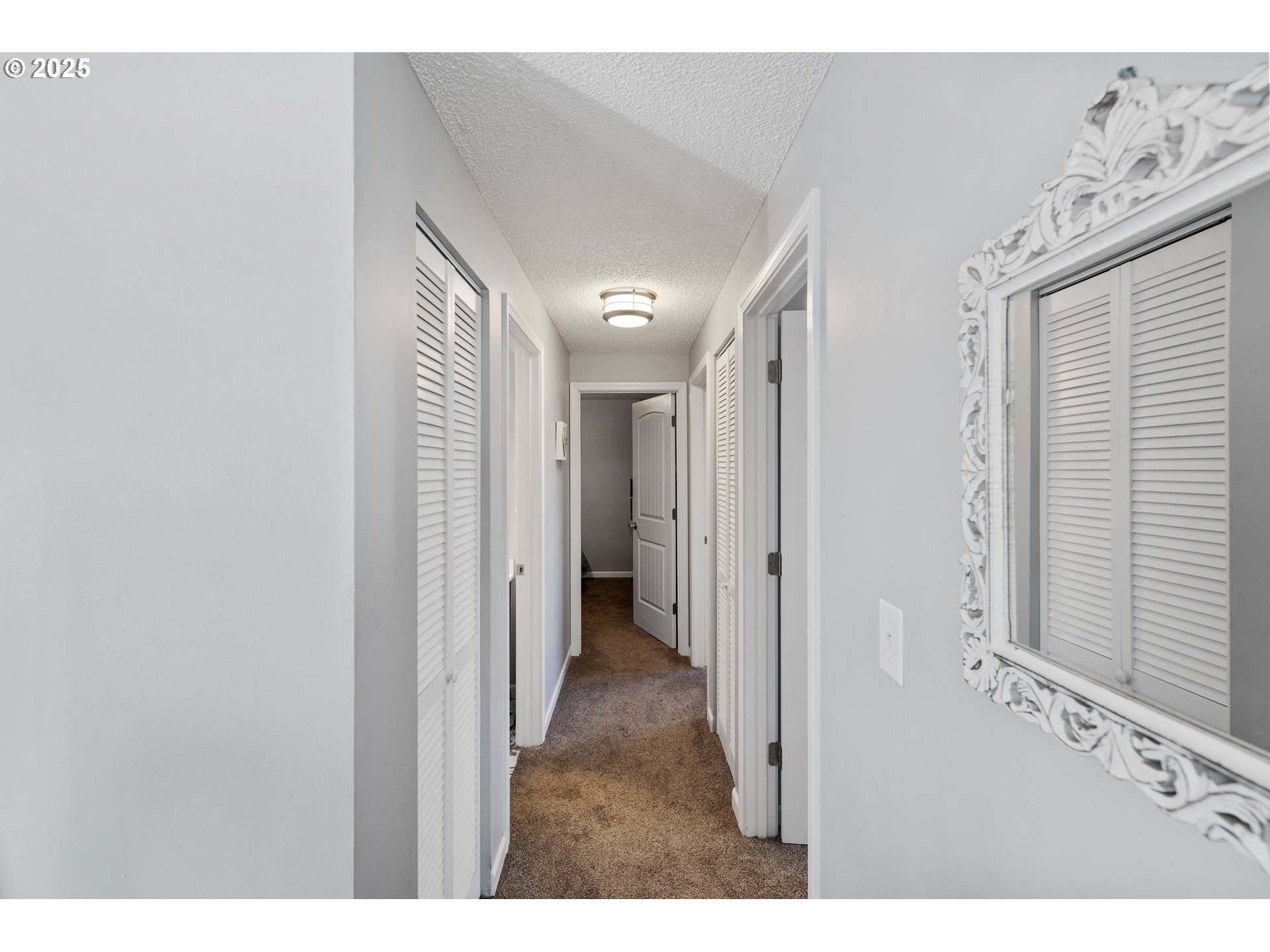 124 Holly Court Reedsport, OR 97467 - Photo 23 of 30 a view of a hallway with wooden floor
