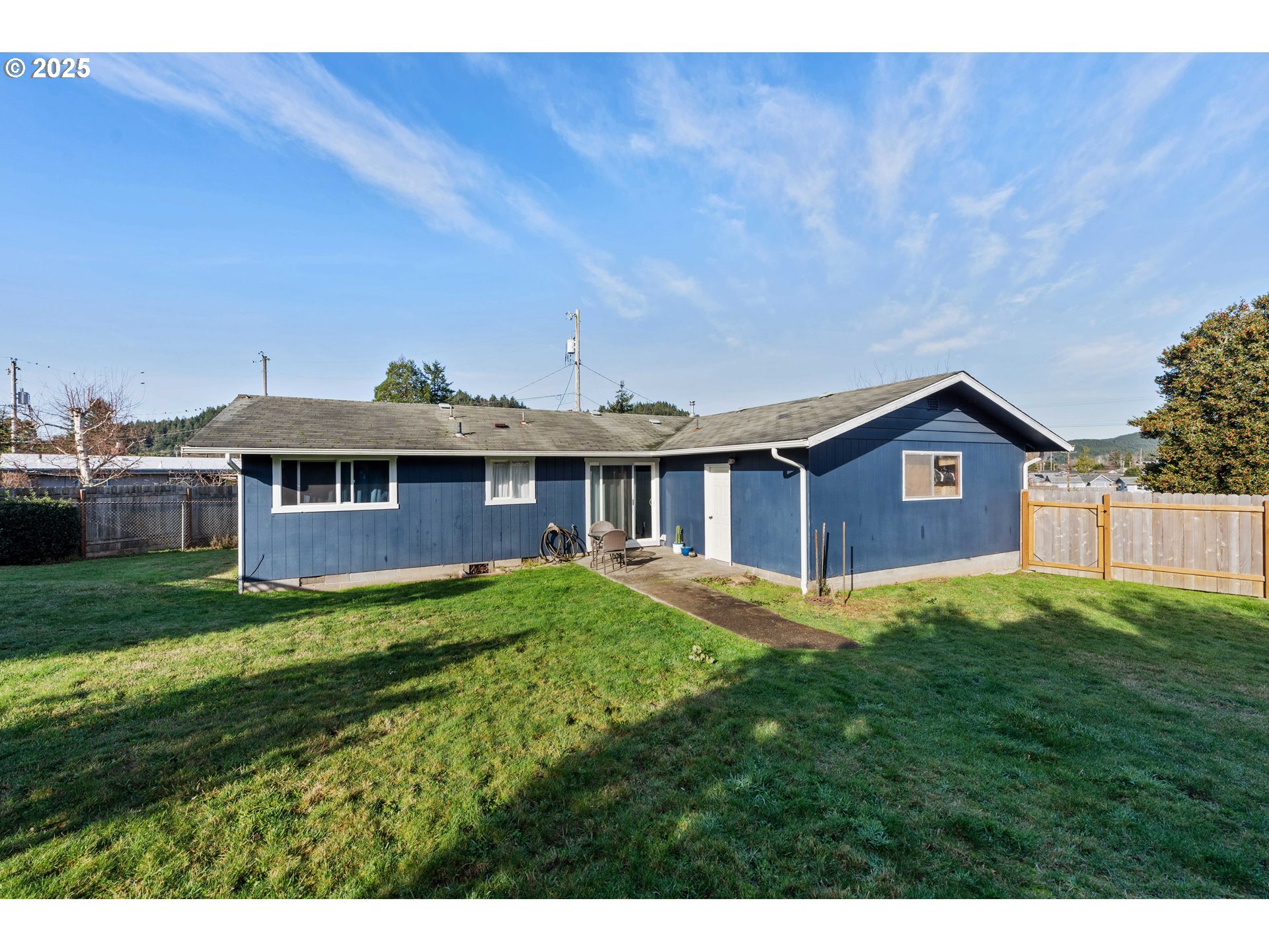 124 Holly Court Reedsport, OR 97467 - Photo 24 of 30 a view of a house with a yard