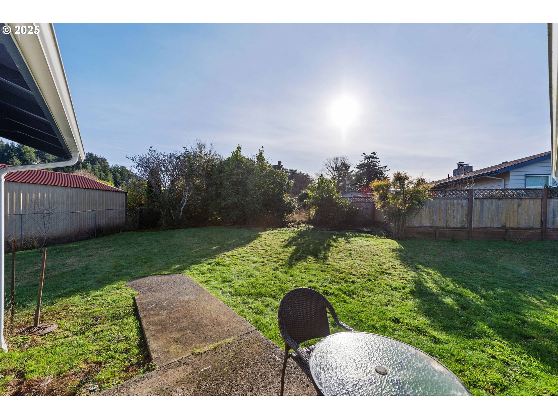 124 Holly Court Reedsport, OR 97467 - Photo 26 of 30 a backyard of a house with lots of green space