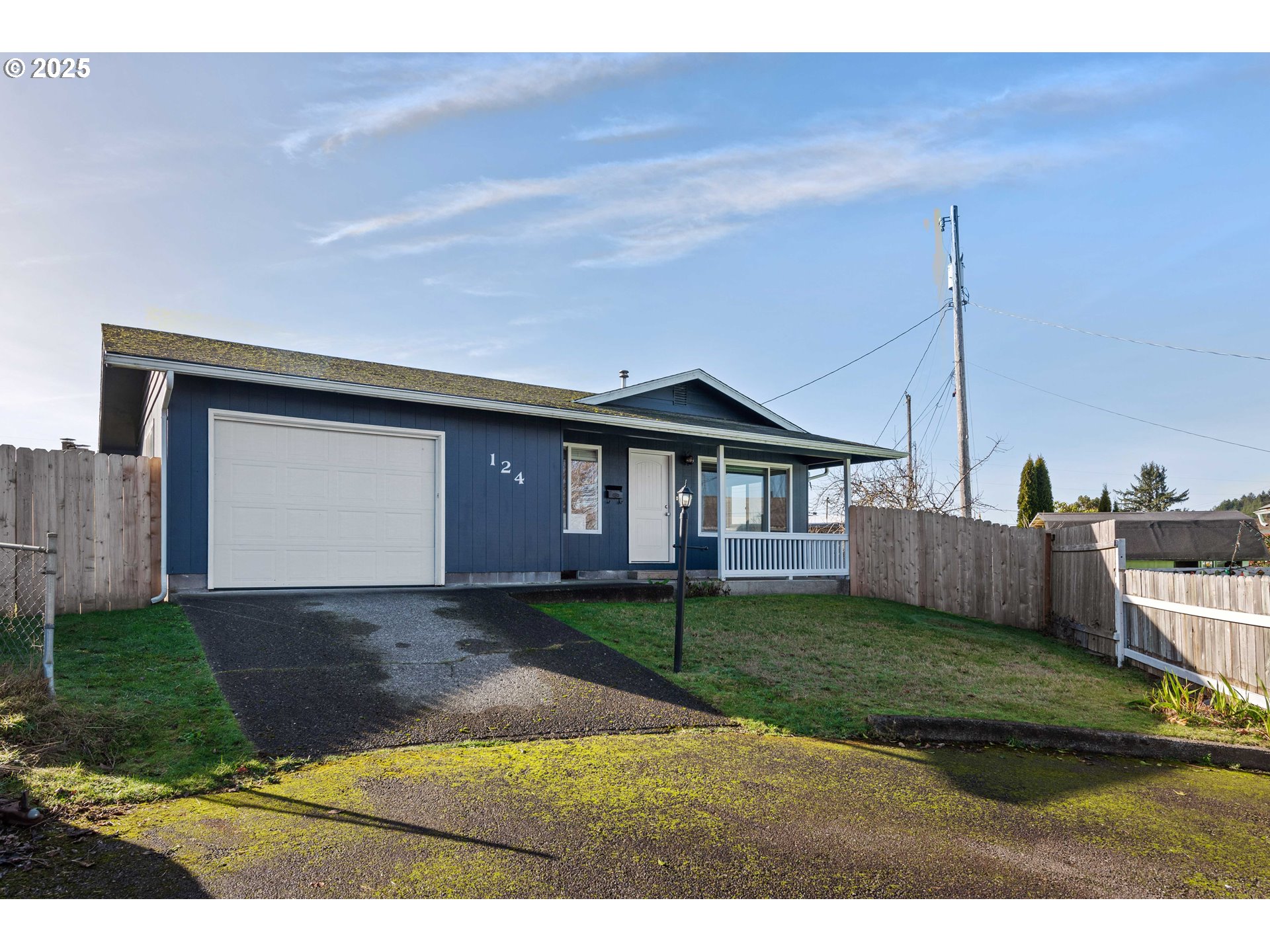 124 Holly Court Reedsport, OR 97467 - Photo 30 of 30 a front view of a house with a garden and yard
