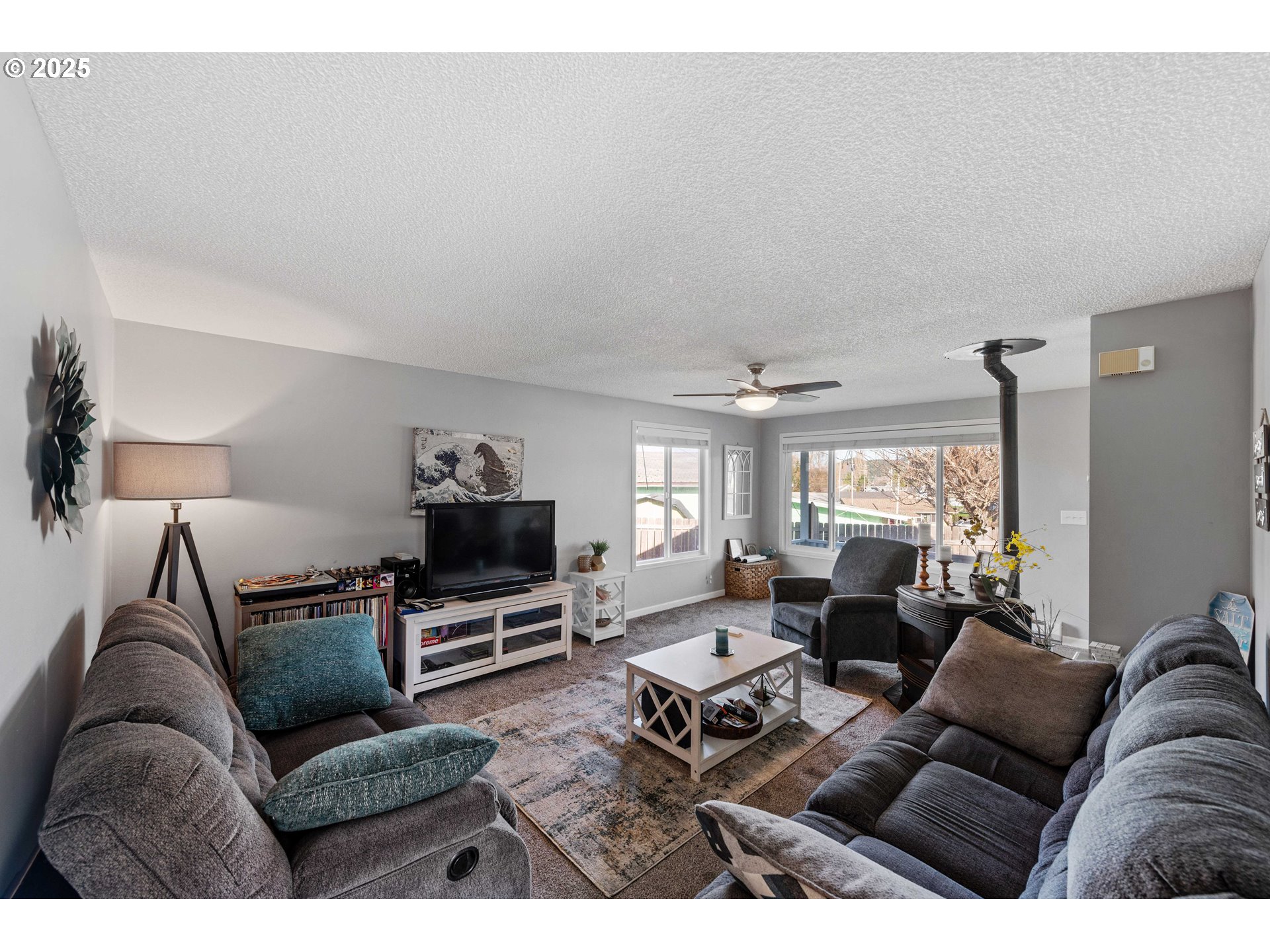 124 Holly Court Reedsport, OR 97467 - Photo 6 of 30 a living room with furniture a flat screen tv and a window