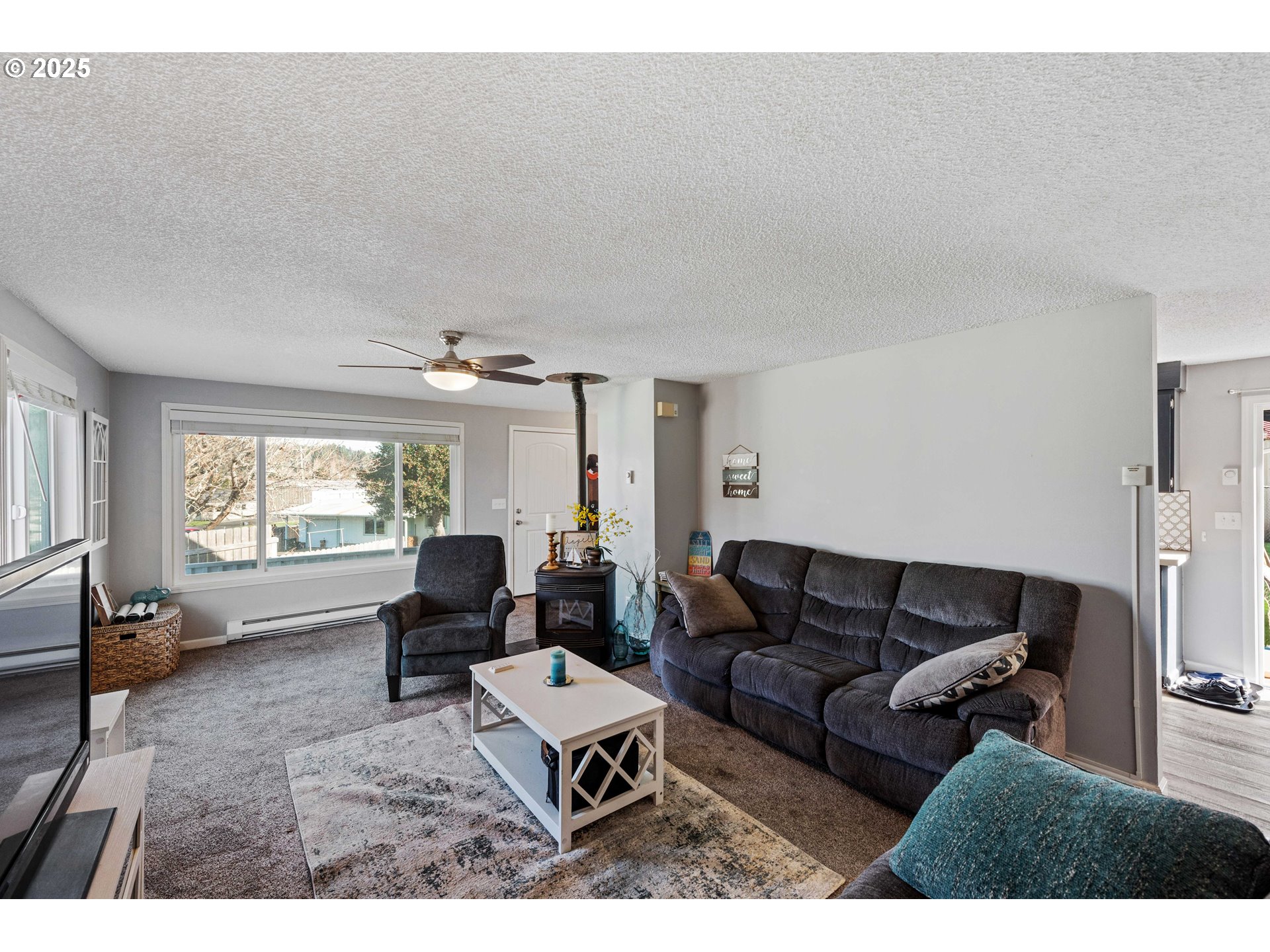 124 Holly Court Reedsport, OR 97467 - Photo 7 of 30 a living room with furniture and a large window