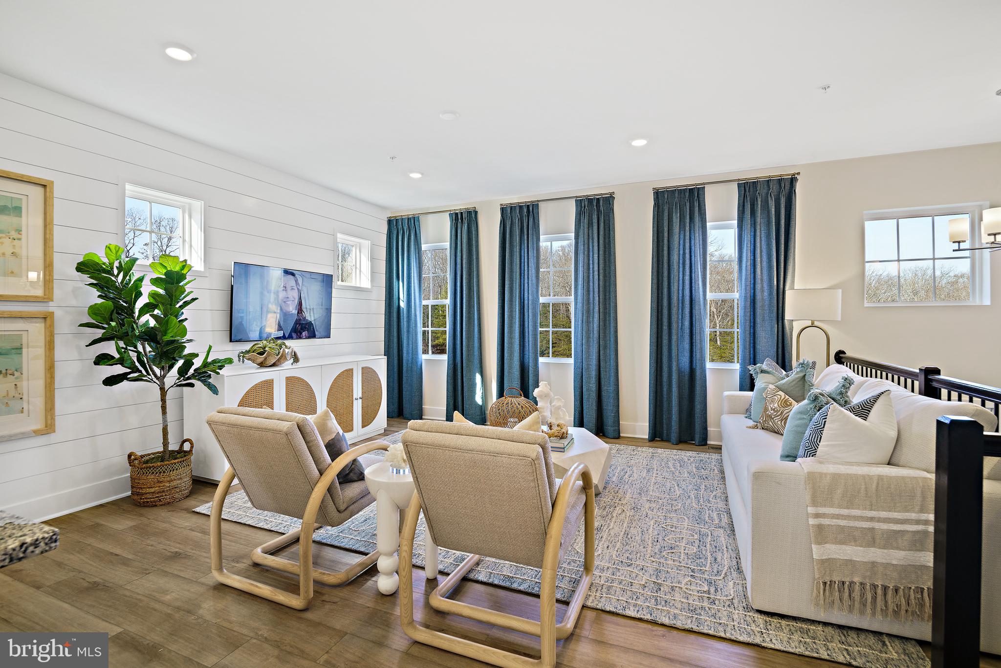 23600 Crosswinds Way California, MD 20619 - Photo 11 of 55 a living room with furniture and a potted plant