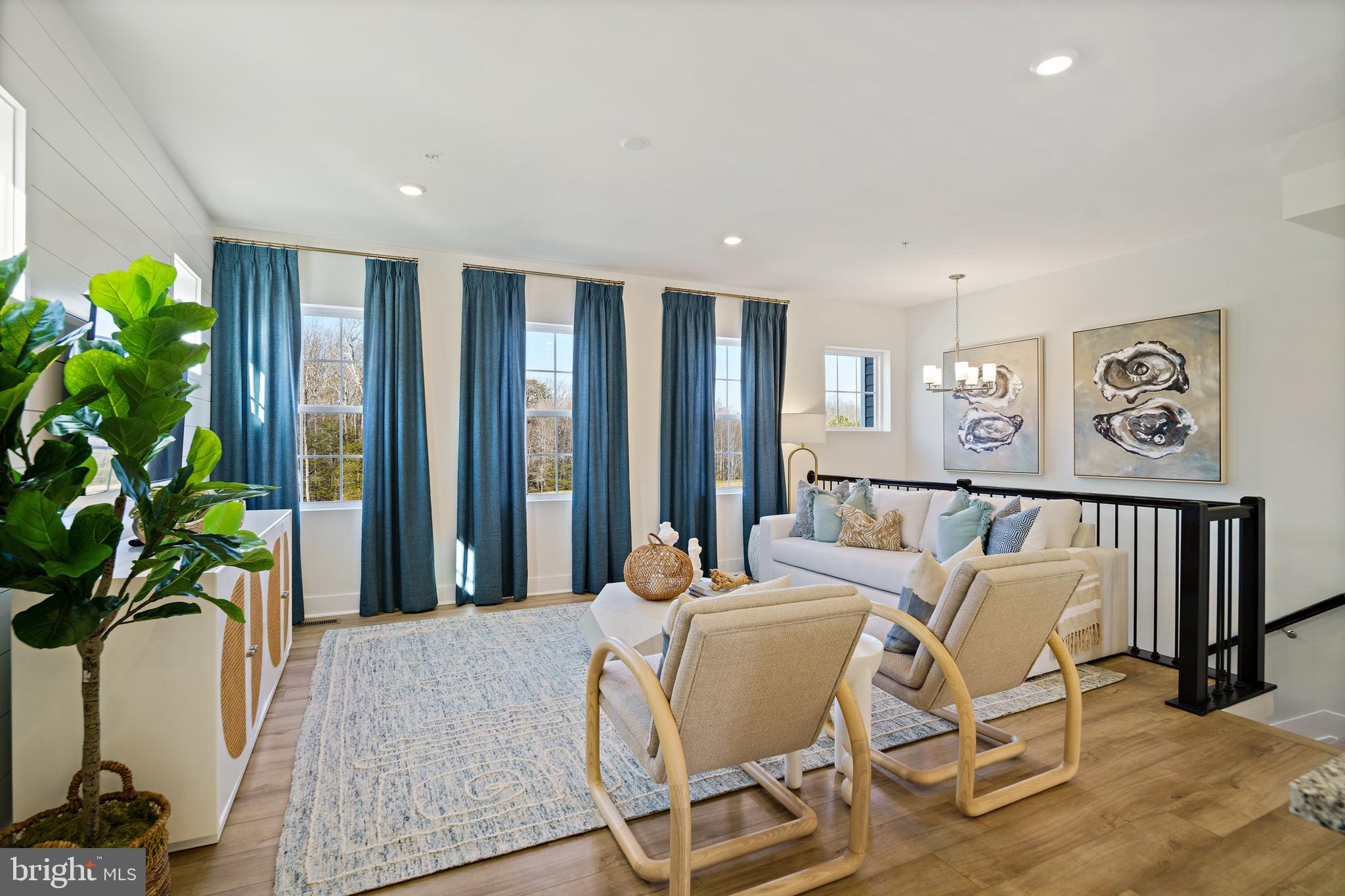 23600 Crosswinds Way California, MD 20619 - Photo 12 of 55 a living room with furniture and a potted plant