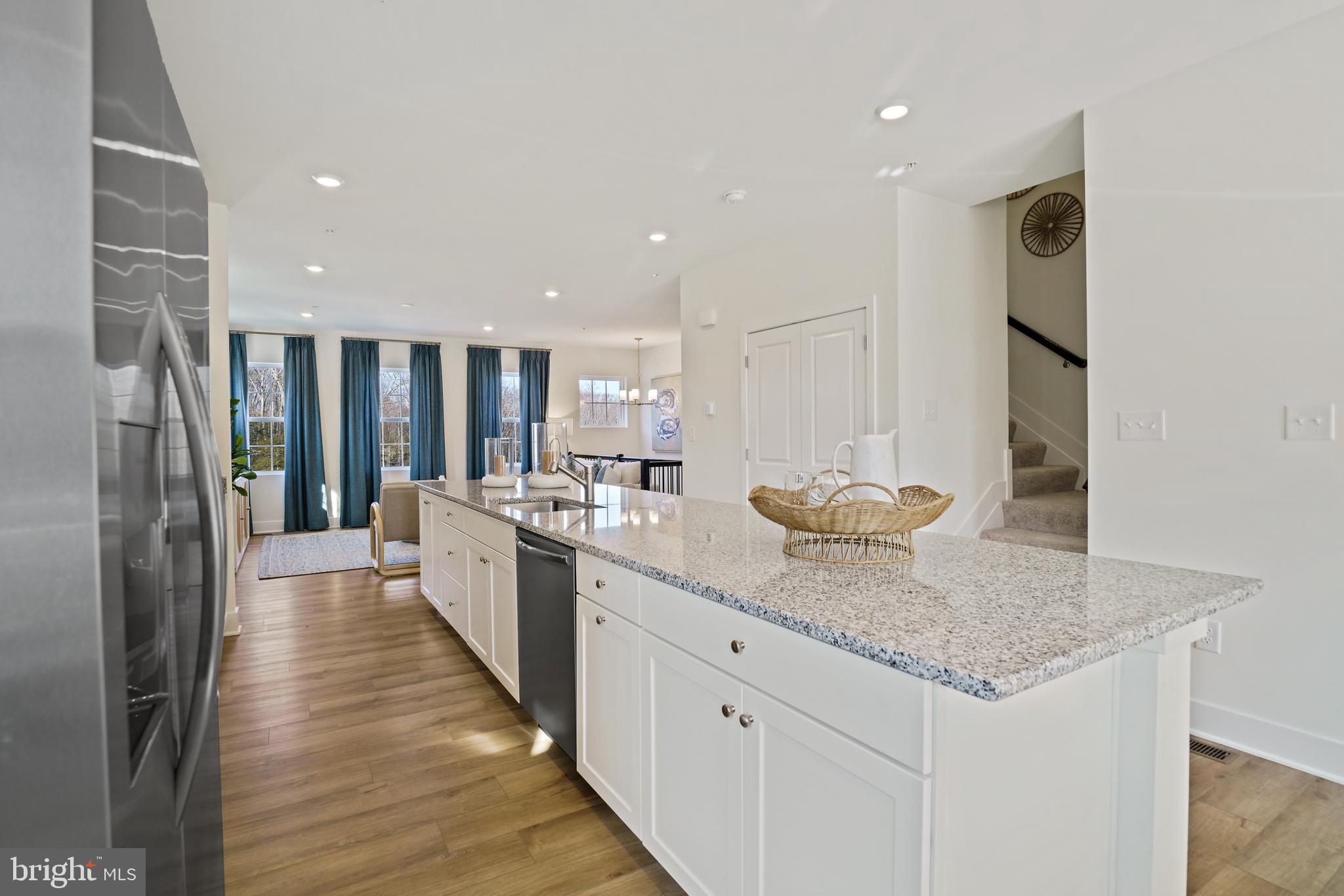 23600 Crosswinds Way California, MD 20619 - Photo 19 of 55 a large kitchen with stainless steel appliances granite countertop a sink and cabinets