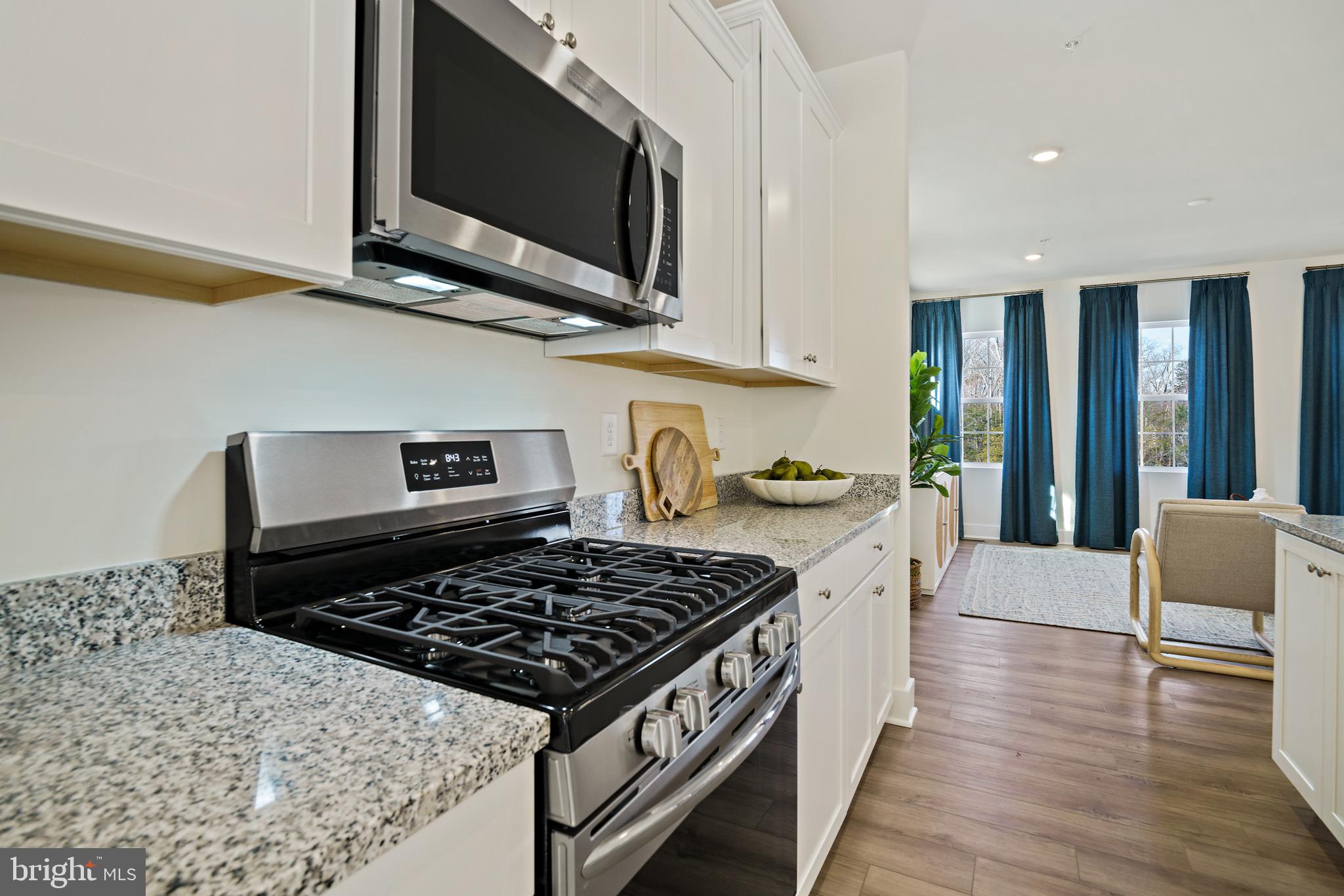 23600 Crosswinds Way California, MD 20619 - Photo 20 of 55 a kitchen with a stove and a microwave