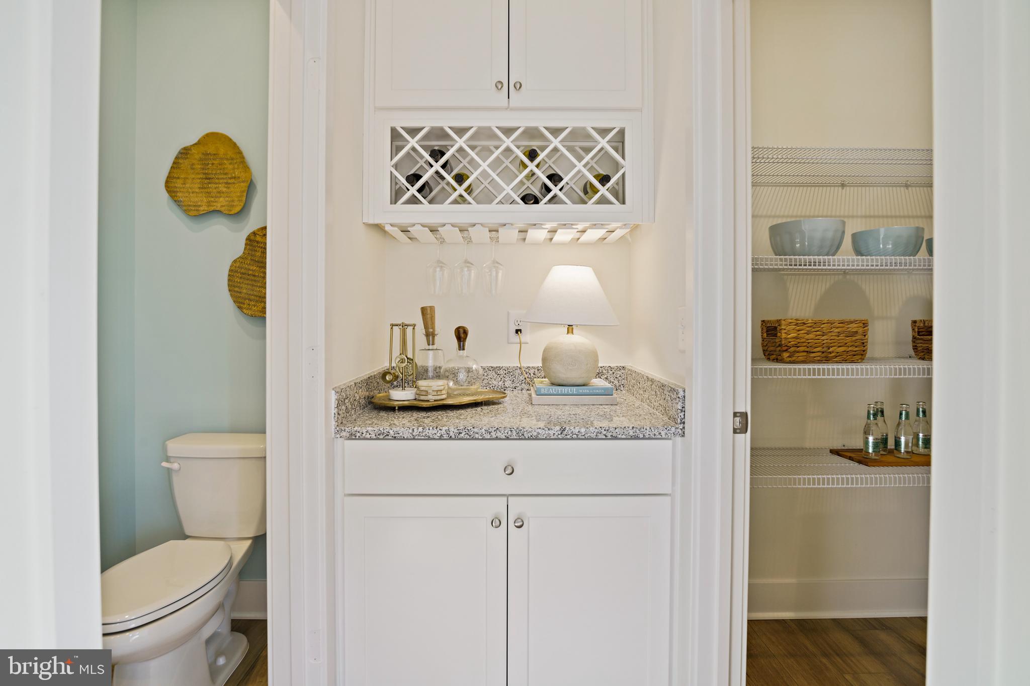 23600 Crosswinds Way California, MD 20619 - Photo 24 of 55 a bathroom with a granite countertop sink mirror vanity and toilet