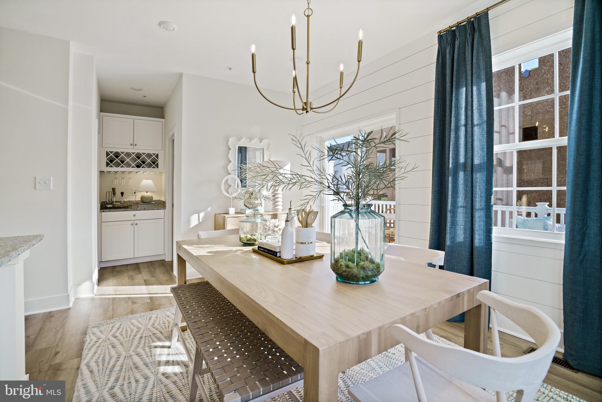 23600 Crosswinds Way California, MD 20619 - Photo 25 of 55 a kitchen with a table chairs and stove