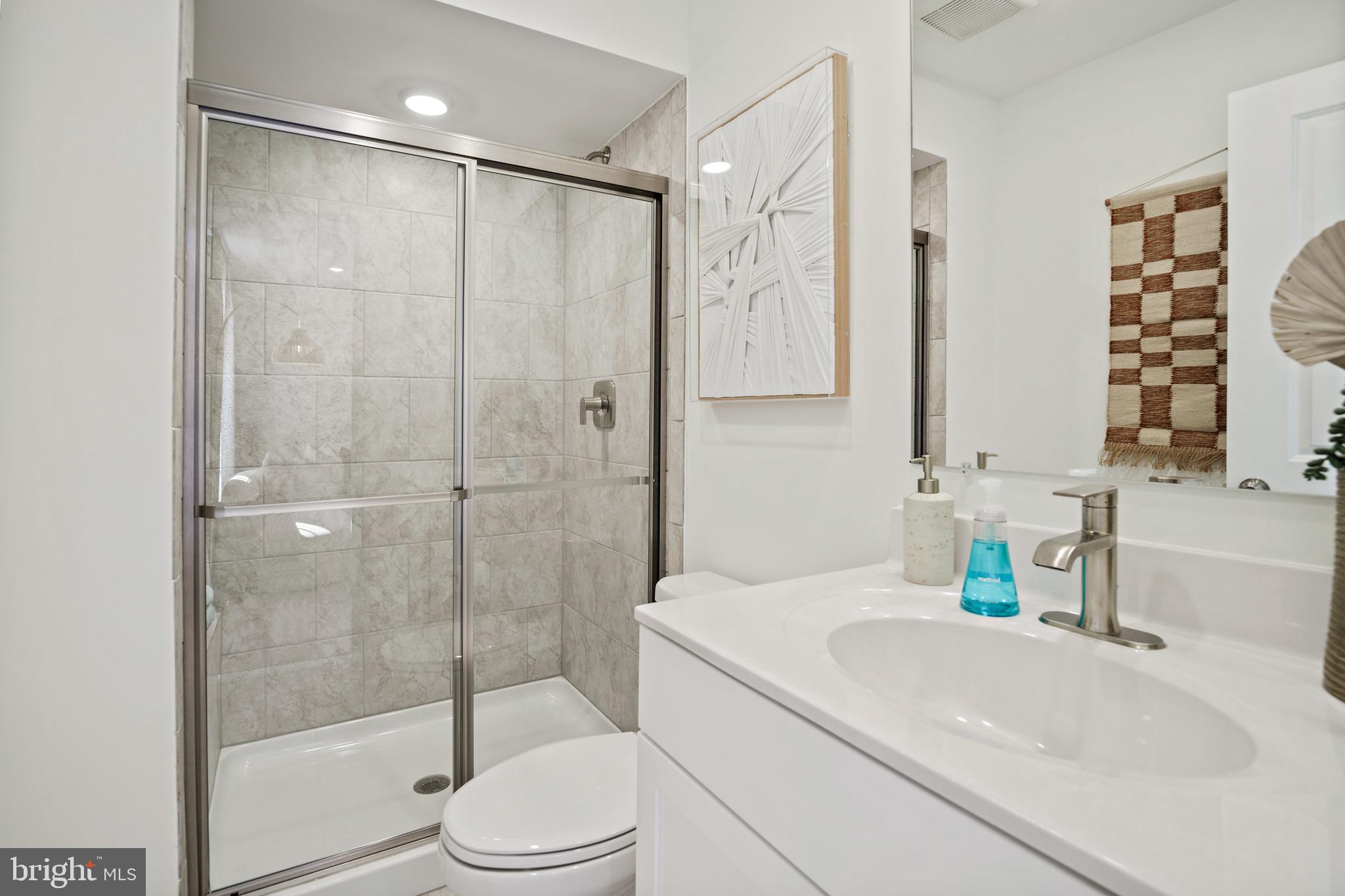 23600 Crosswinds Way California, MD 20619 - Photo 27 of 55 a bathroom with a sink toilet and shower