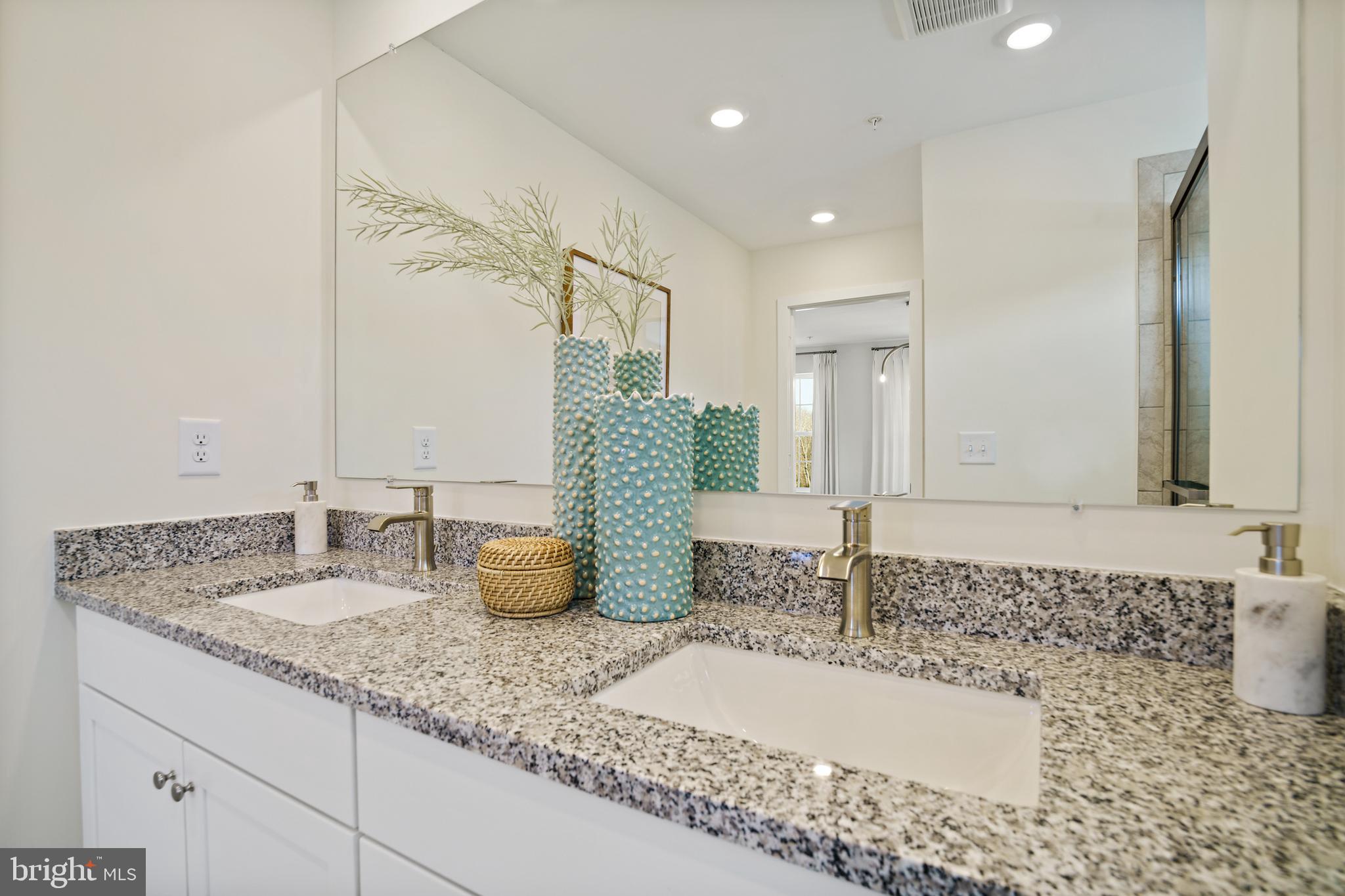 23600 Crosswinds Way California, MD 20619 - Photo 39 of 55 a bathroom with a granite countertop sink and a mirror