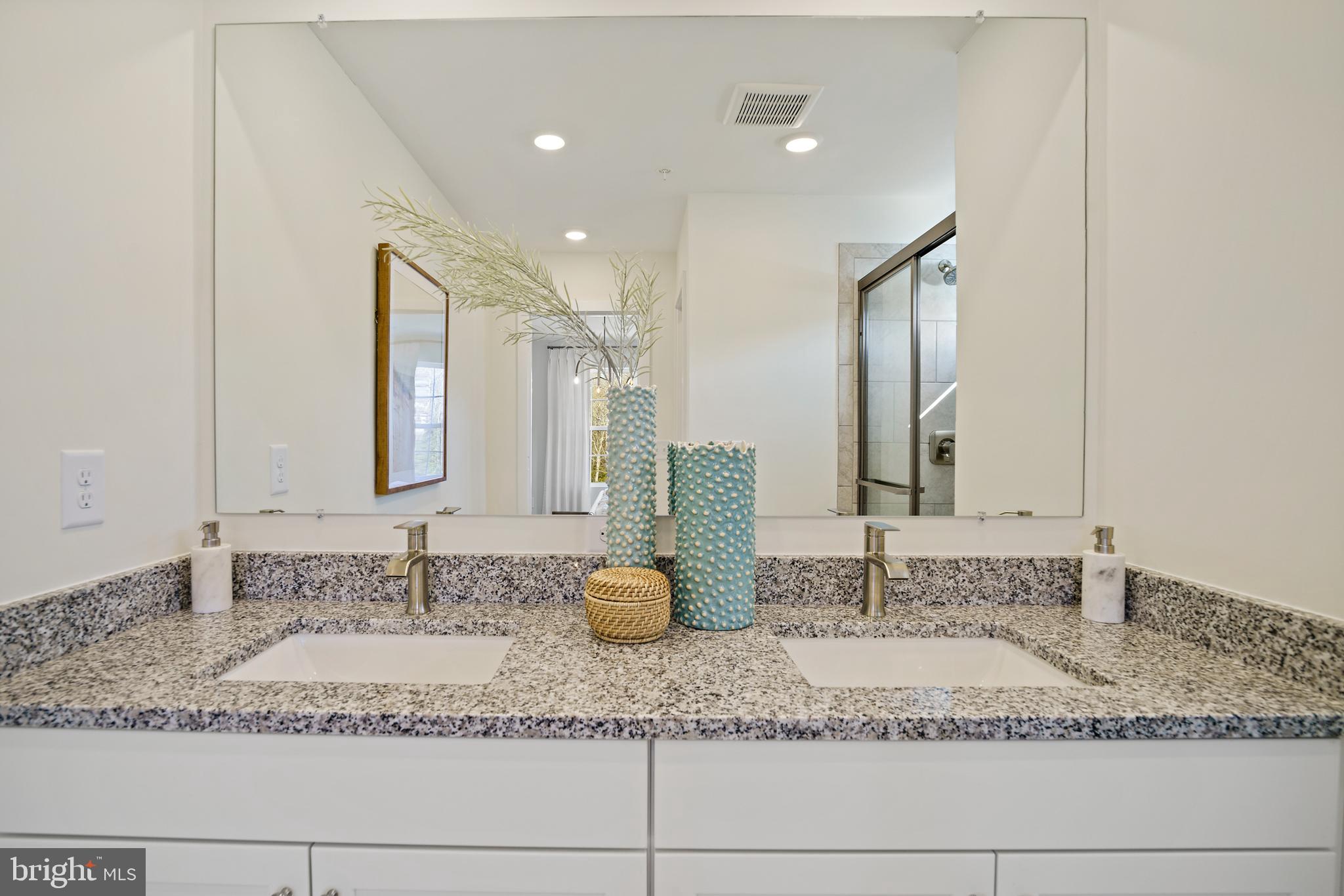 23600 Crosswinds Way California, MD 20619 - Photo 40 of 55 a bathroom with a sink and a mirror