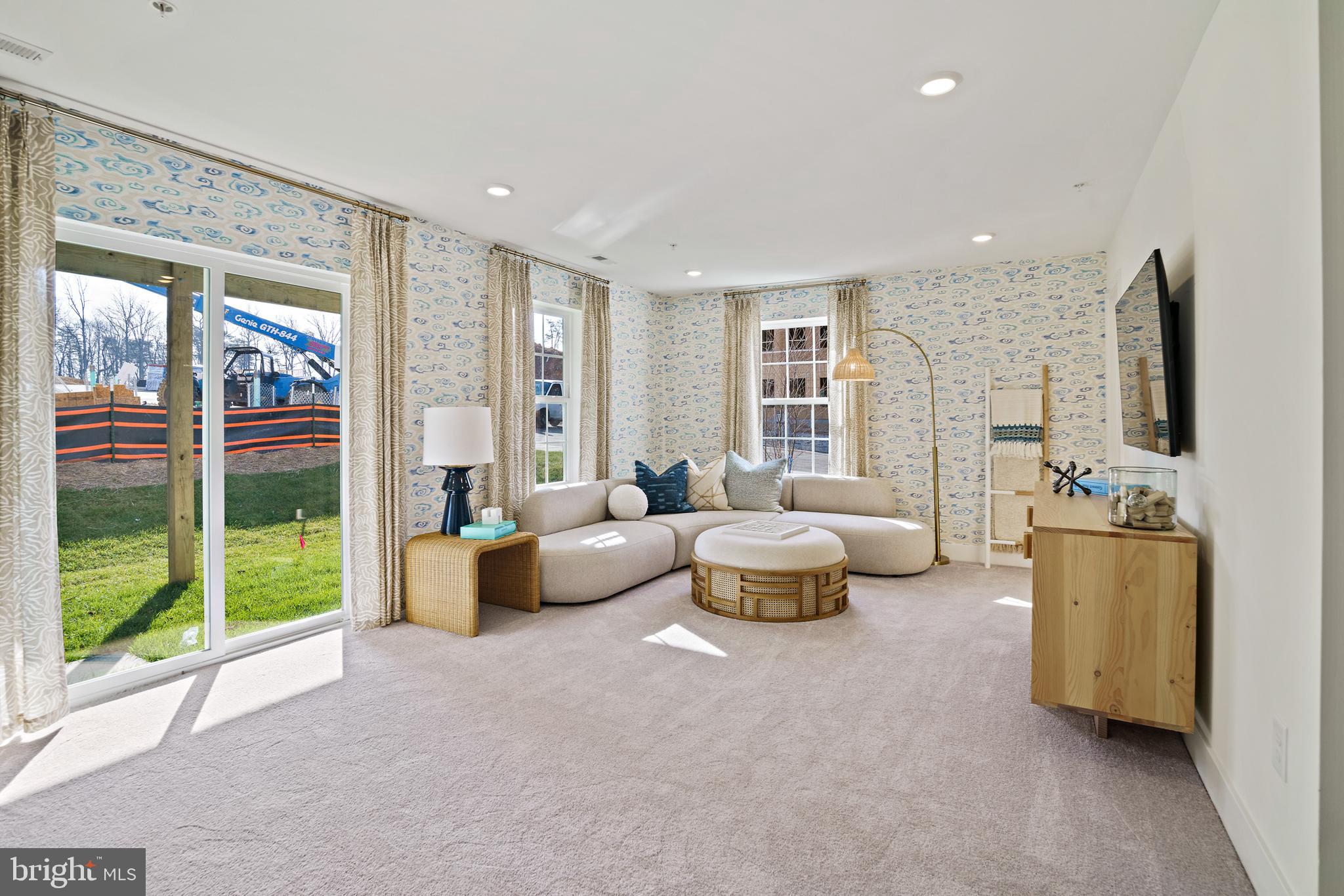 23600 Crosswinds Way California, MD 20619 - Photo 44 of 55 a living room with furniture and a flat screen tv