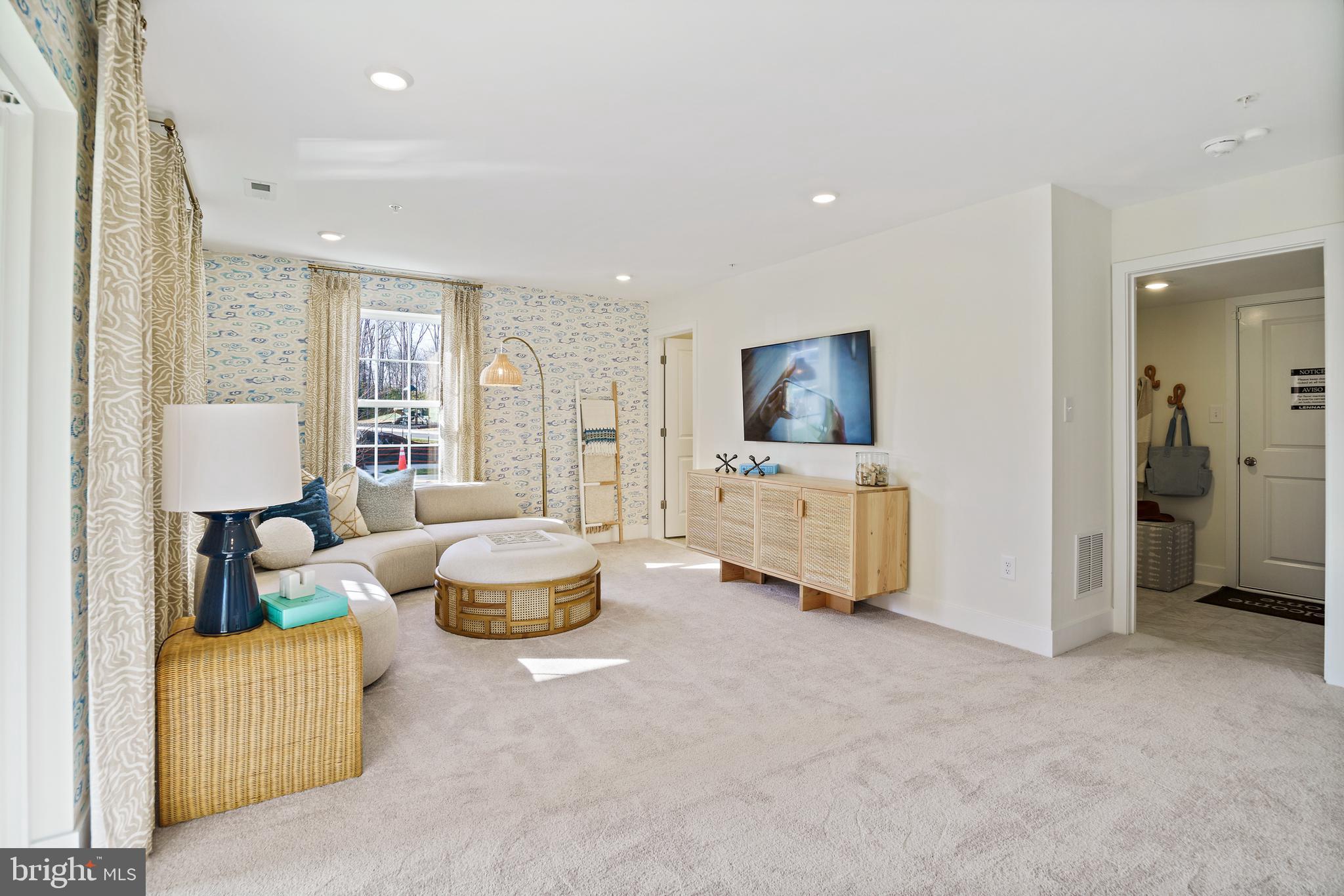 23600 Crosswinds Way California, MD 20619 - Photo 45 of 55 a living room with furniture and a flat screen tv