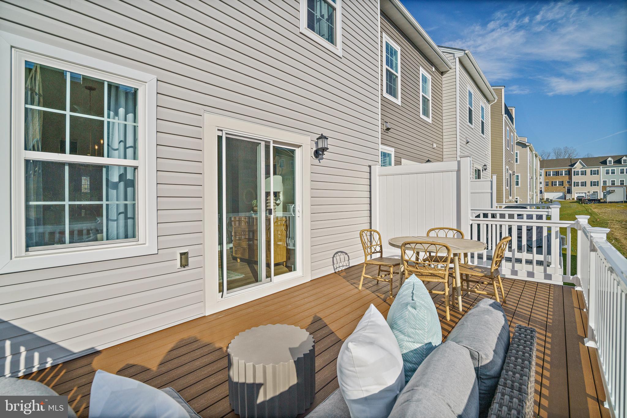 23600 Crosswinds Way California, MD 20619 - Photo 49 of 55 a view of a patio with couches chairs and wooden floor