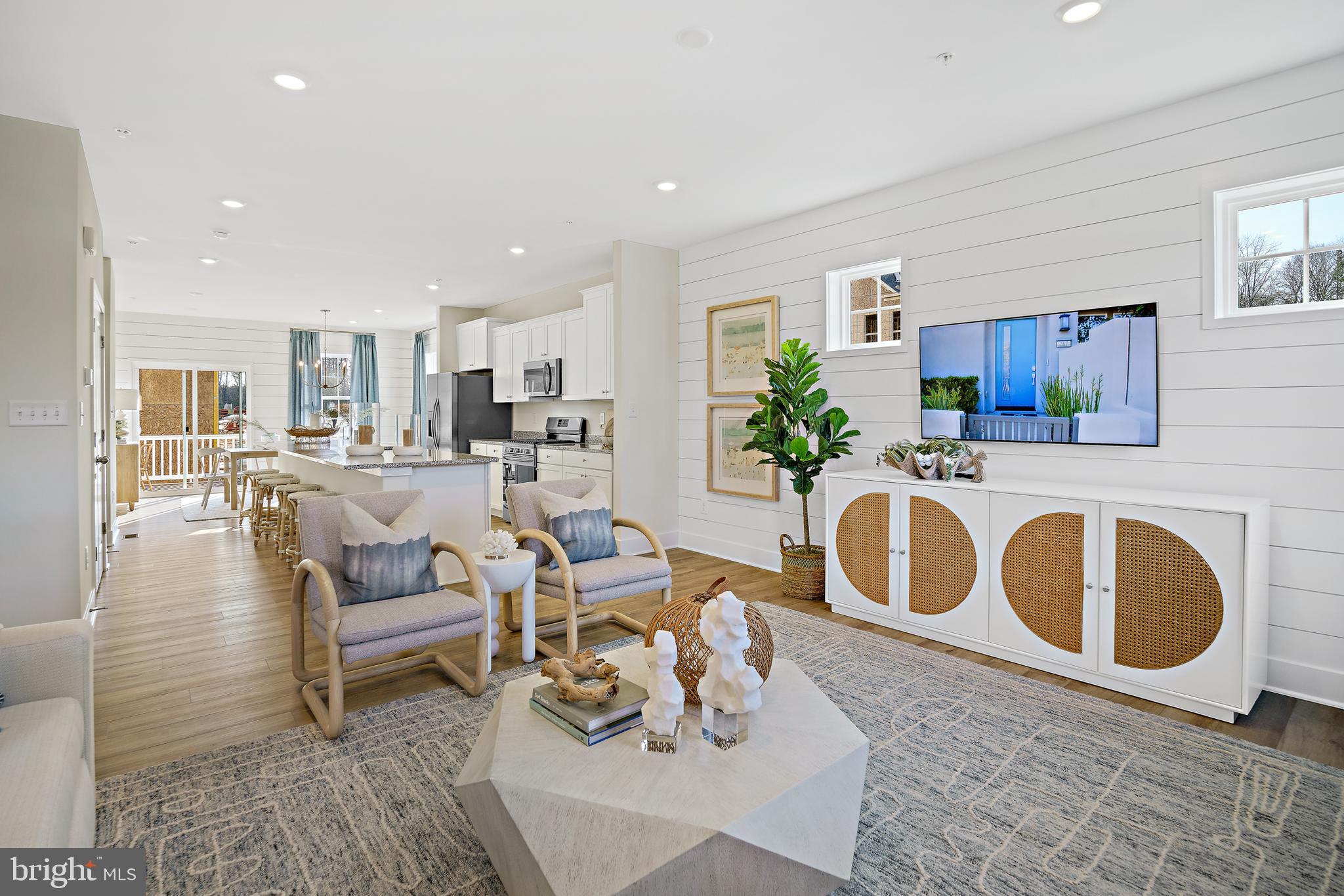 23600 Crosswinds Way California, MD 20619 - Photo 7 of 55 a living room with kitchen island furniture and a kitchen view