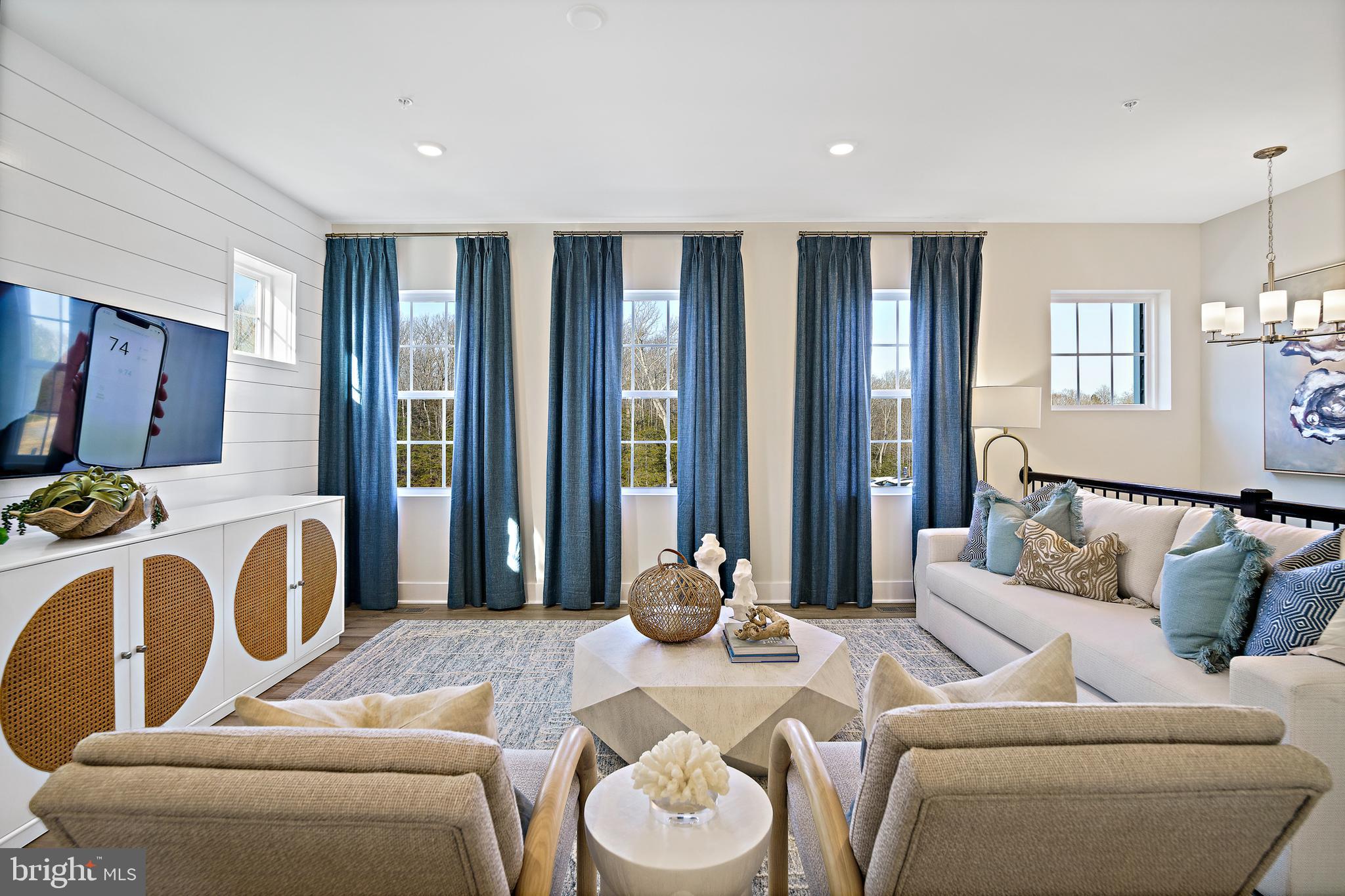 23600 Crosswinds Way California, MD 20619 - Photo 9 of 55 a living room with furniture and a large window
