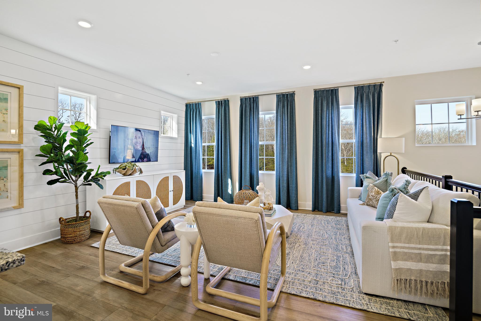 23600 Crosswinds Way California, MD 20619 - Photo 10 of 55 a living room with furniture and a potted plant