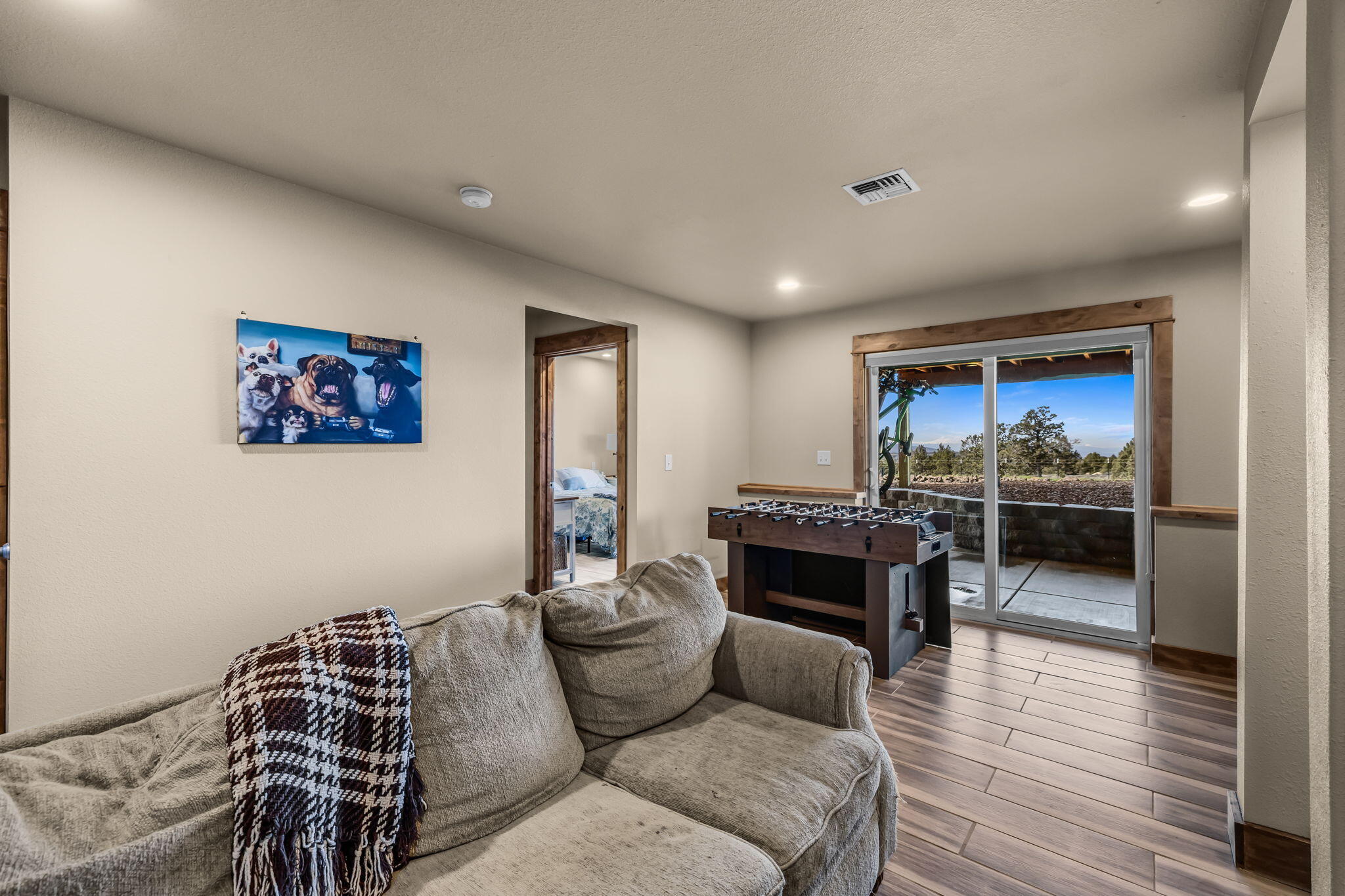 6040 Gravett Road Prineville, OR 97754 - Photo 29 of 77 a living room with furniture and a wooden floor