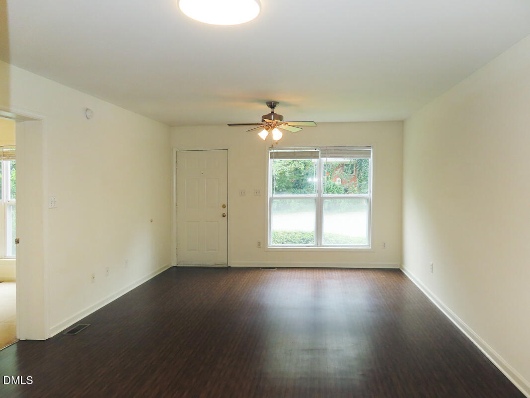 314 Davie Road, Unit B Carrboro, NC 27510 - Photo 3 of 15 an empty room with wooden floor and windows