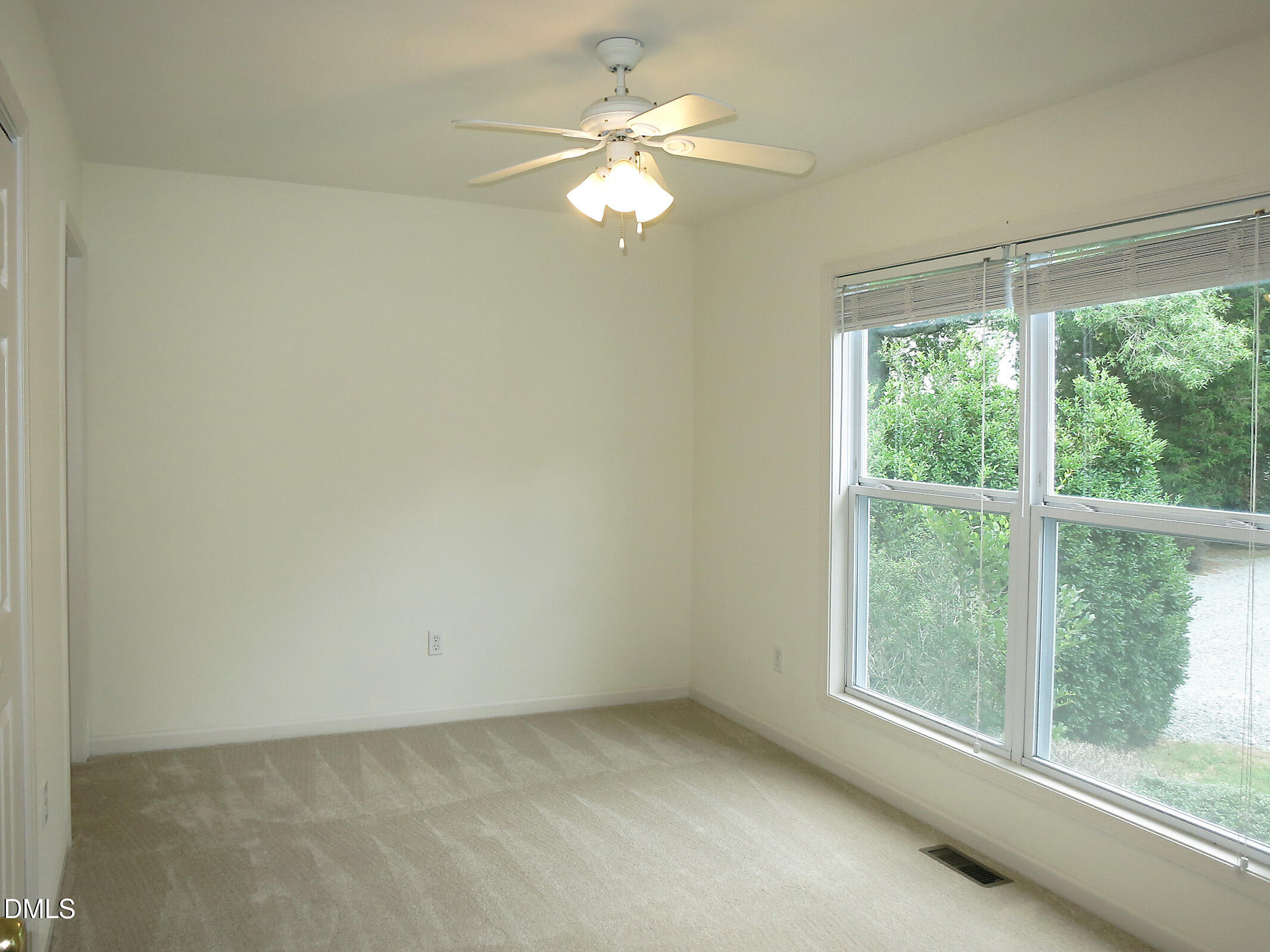 314 Davie Road, Unit B Carrboro, NC 27510 - Photo 6 of 15 wooden floor in an empty room with a window