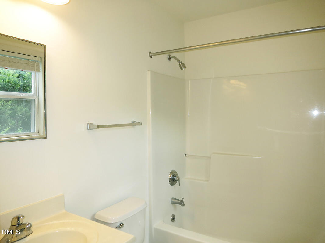 314 Davie Road, Unit B Carrboro, NC 27510 - Photo 7 of 15 a bathroom with a bathtub and a shower
