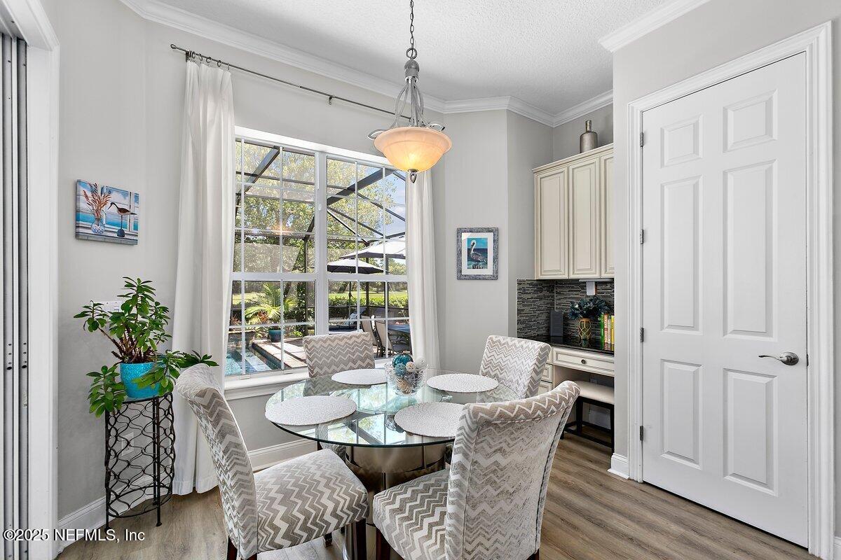 417 Blagdon Court Jacksonville, FL 32225 - Photo 13 of 43 a view of a dining room with furniture window and wooden floor