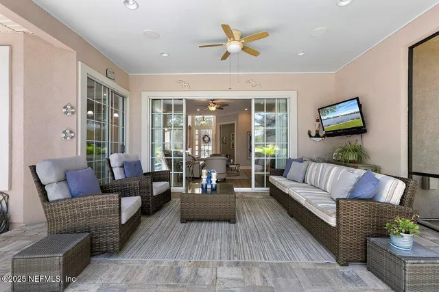 a living room with furniture and a flat screen tv