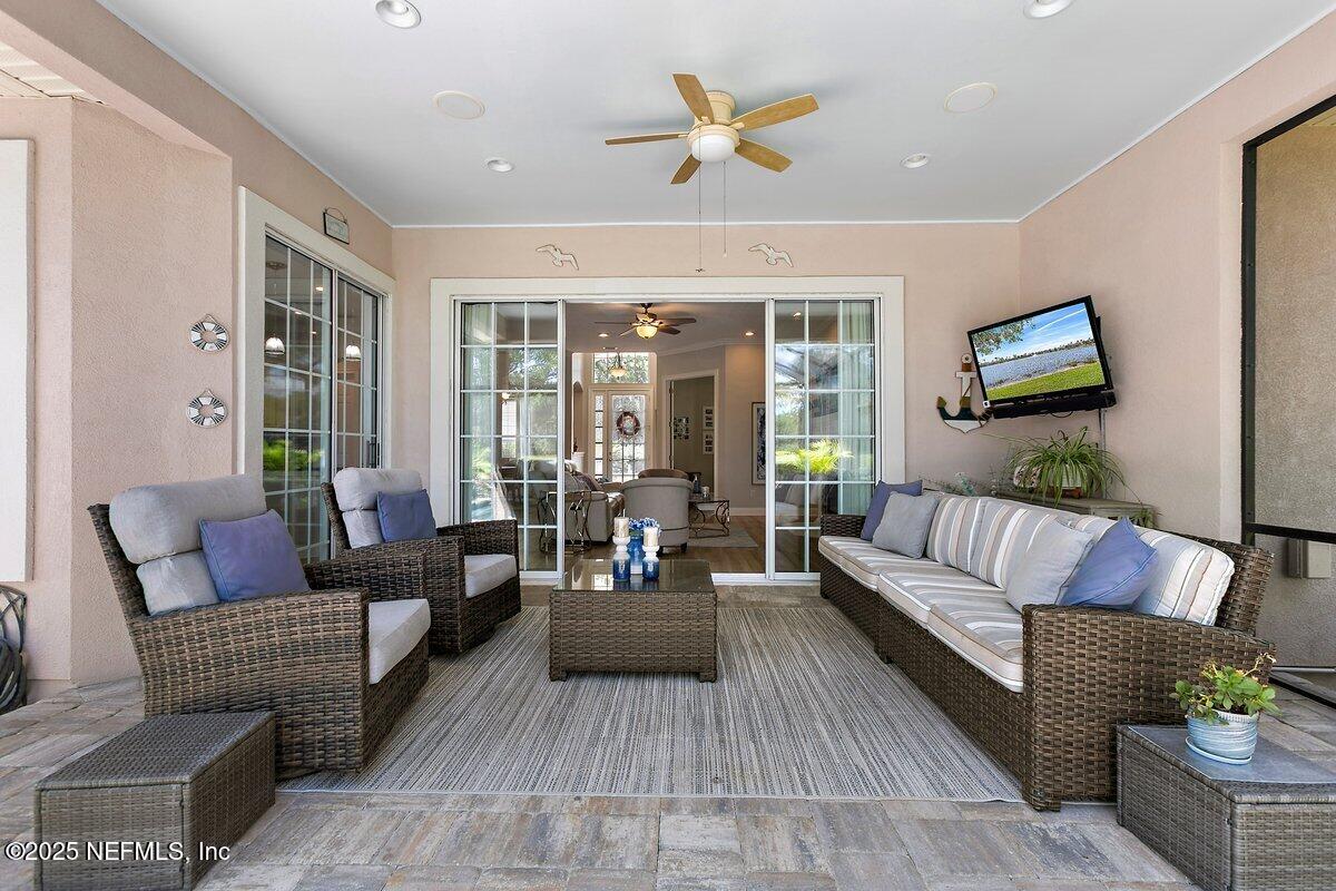 417 Blagdon Court Jacksonville, FL 32225 - Photo 16 of 43 a living room with furniture and a flat screen tv