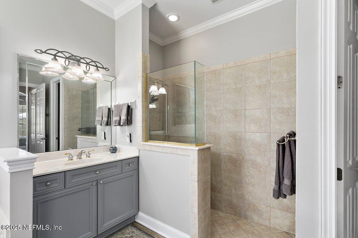 417 Blagdon Court Jacksonville, FL 32225 - Photo 23 of 43 a bathroom with a double vanity sink mirror and shower