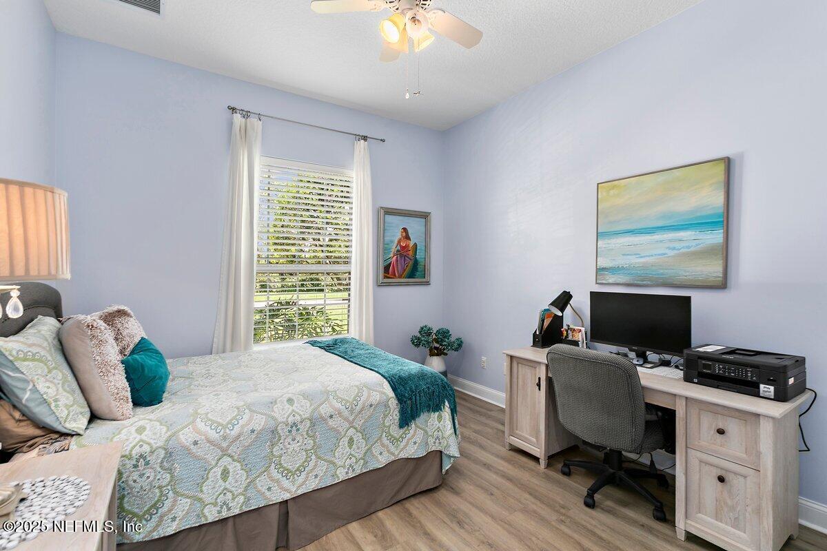 417 Blagdon Court Jacksonville, FL 32225 - Photo 24 of 43 a bedroom with a bed and a desk