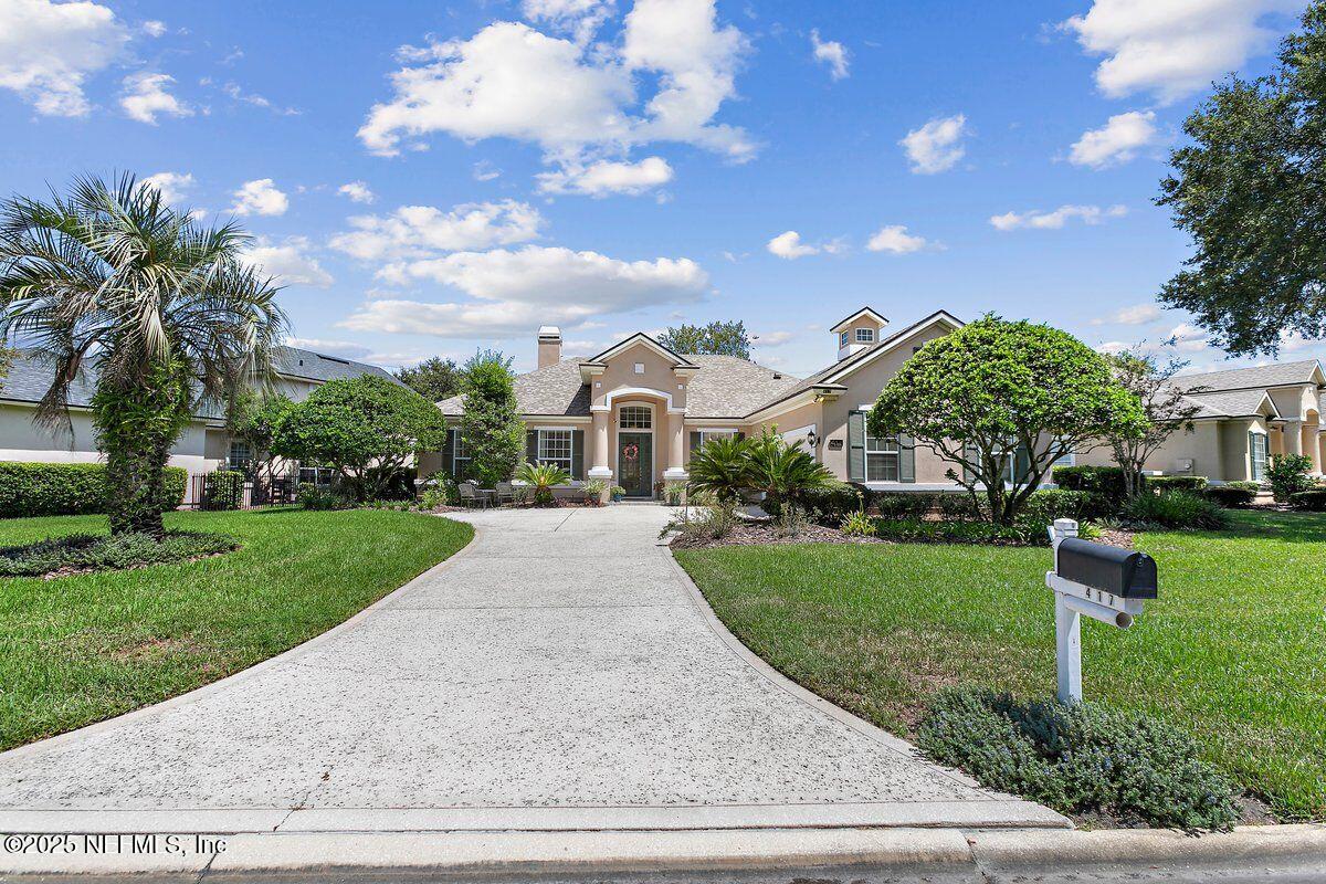 417 Blagdon Court Jacksonville, FL 32225 - Photo 27 of 43 a front view of a house with yard and green space