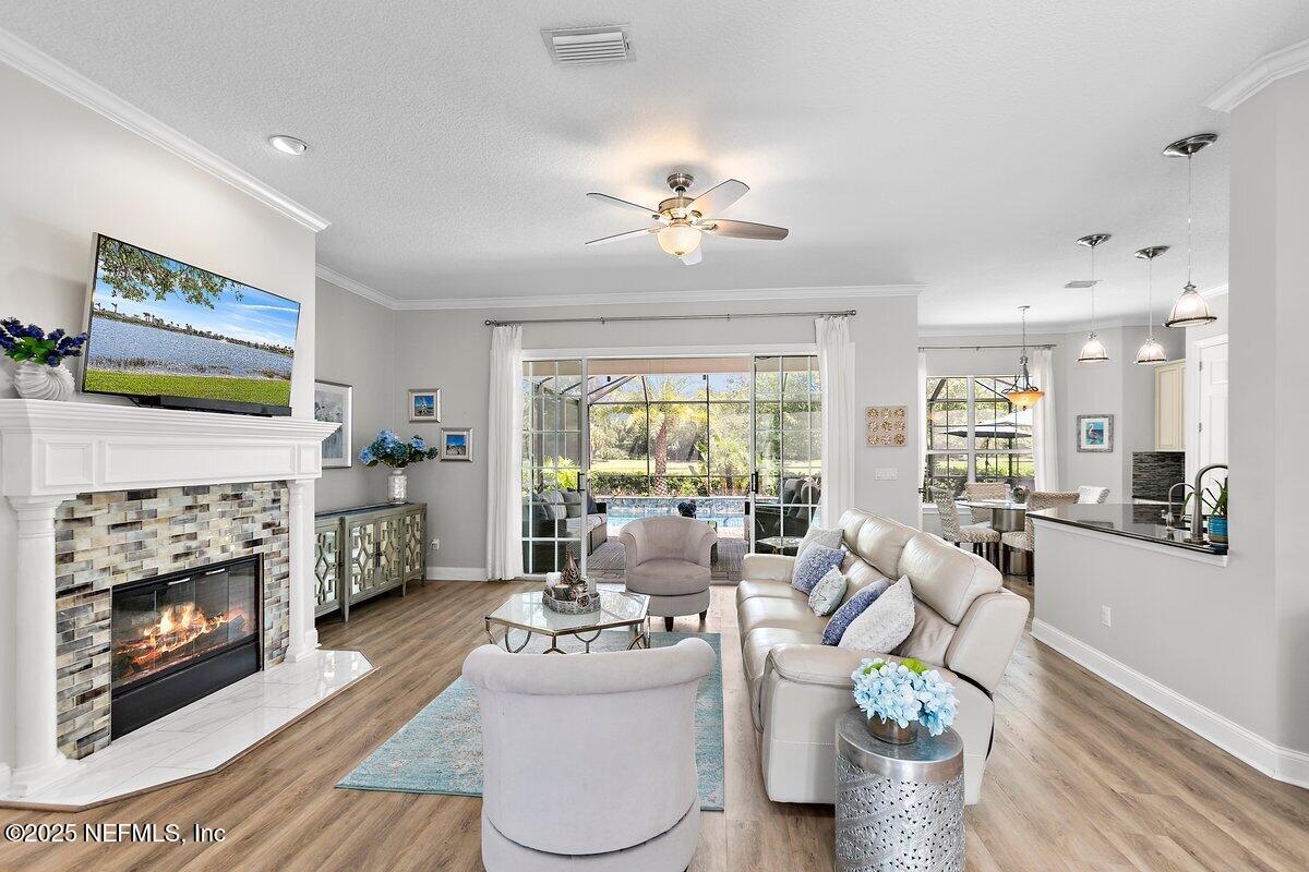 417 Blagdon Court Jacksonville, FL 32225 - Photo 7 of 43 a living room with furniture and a fireplace