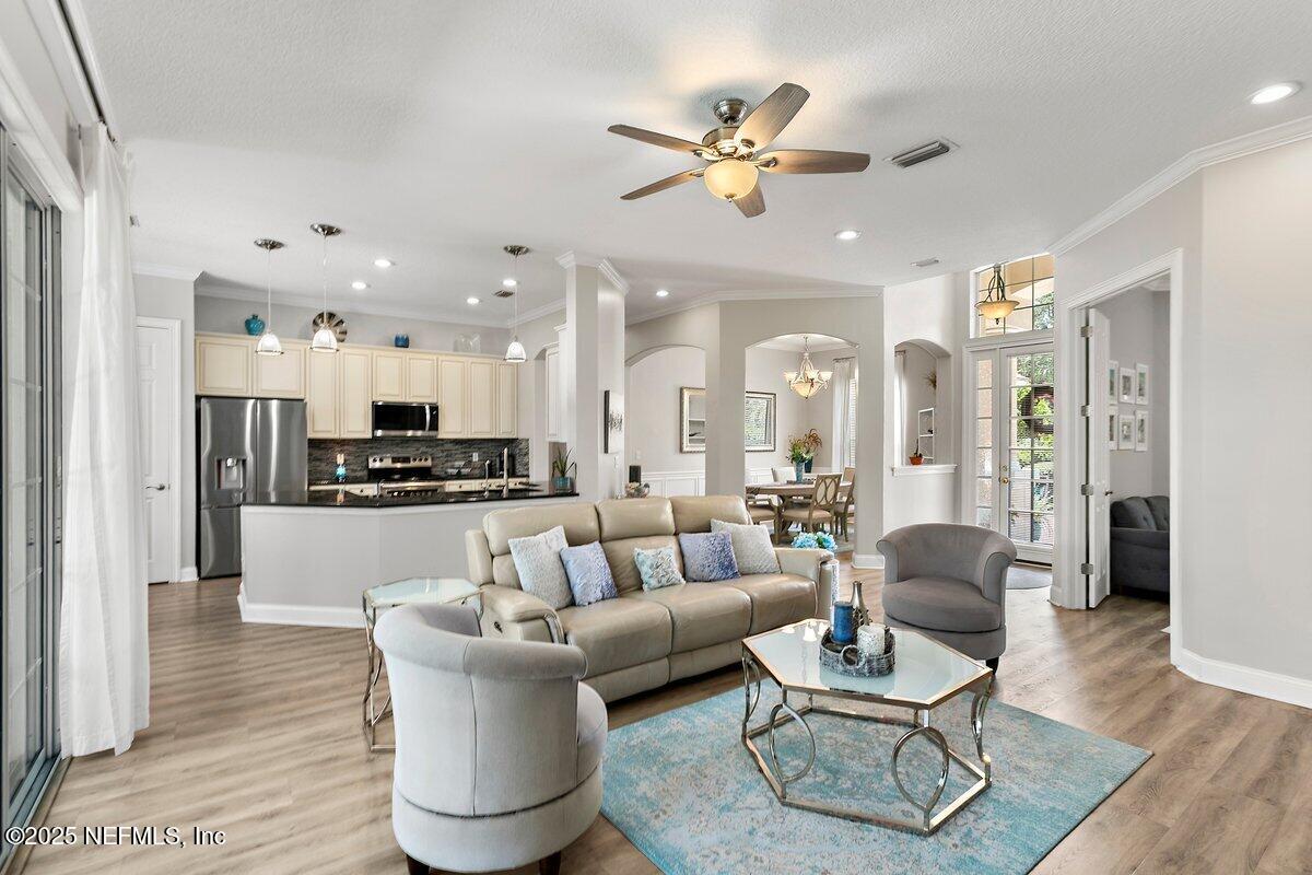 417 Blagdon Court Jacksonville, FL 32225 - Photo 9 of 43 a living room with furniture kitchen and a chandelier