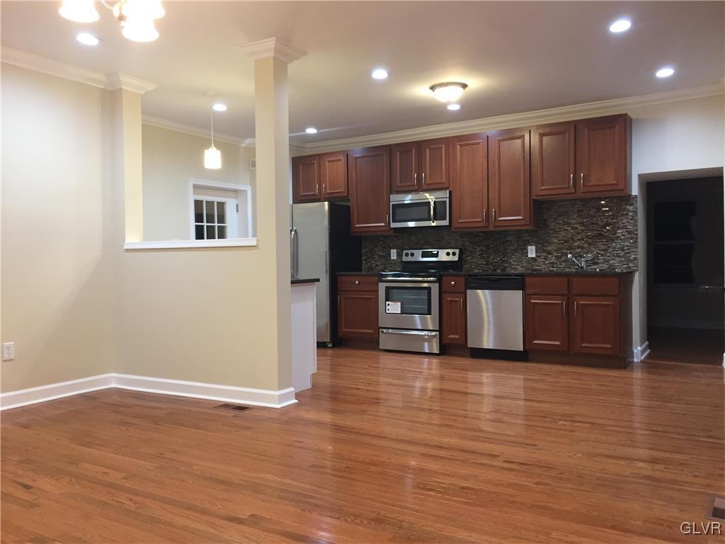 4447 Shankweiler Road Orefield, PA 18069 - Photo 4 of 11 a kitchen with stainless steel appliances granite countertop a refrigerator and a stove top oven