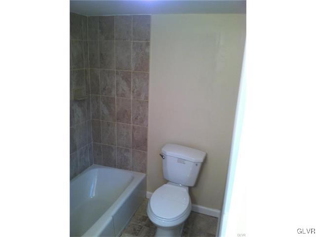 4447 Shankweiler Road Orefield, PA 18069 - Photo 8 of 11 a white toilet sitting next to a bath tub