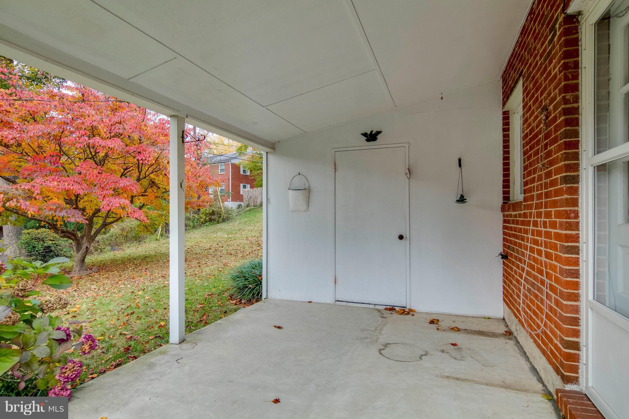 6804 Queens Ferry Road Baltimore, MD 21239 - Photo 29 of 30 Covered patio with built-in storage shed