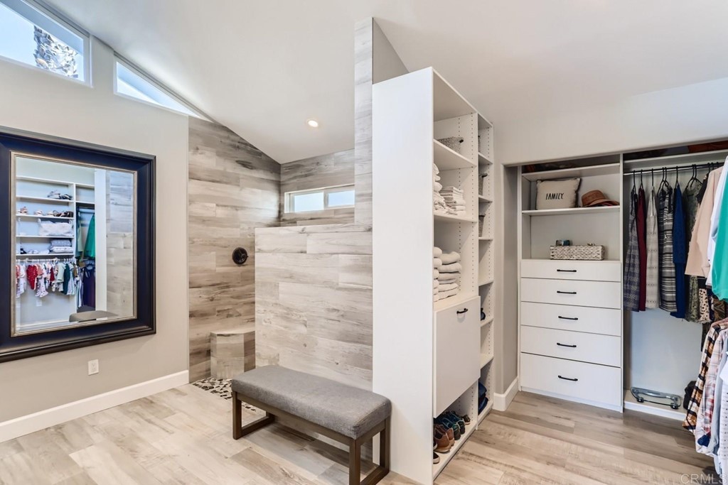 2015 Shadow Grove Way Encinitas, CA 92024 - Photo 14 of 28 a view of walk in closet with clothes and shoes