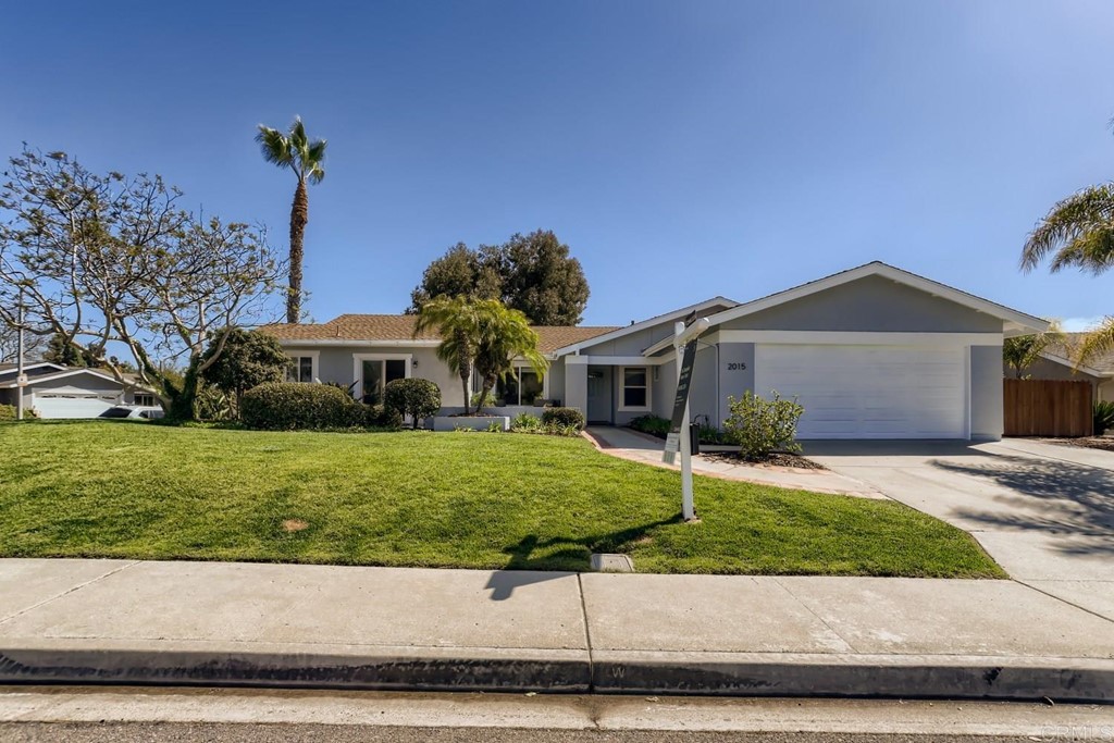 2015 Shadow Grove Way Encinitas, CA 92024 - Photo 2 of 28 a front view of a house with a garden