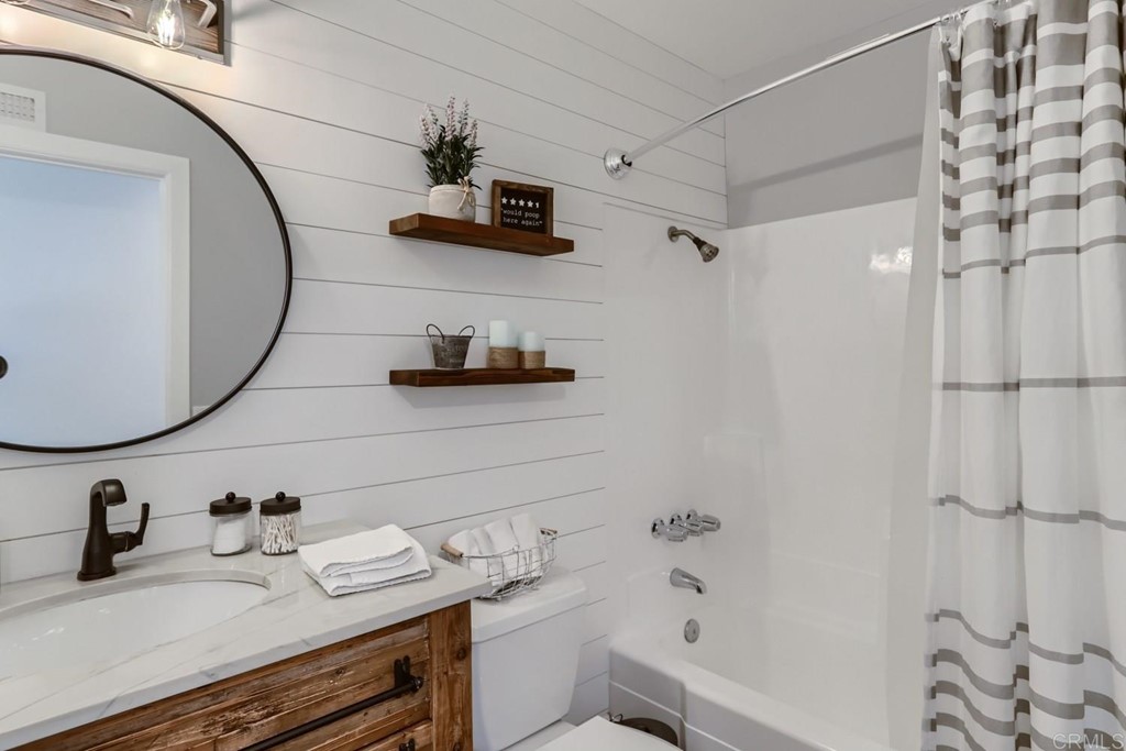 2015 Shadow Grove Way Encinitas, CA 92024 - Photo 21 of 28 a bathroom with a sink and a mirror