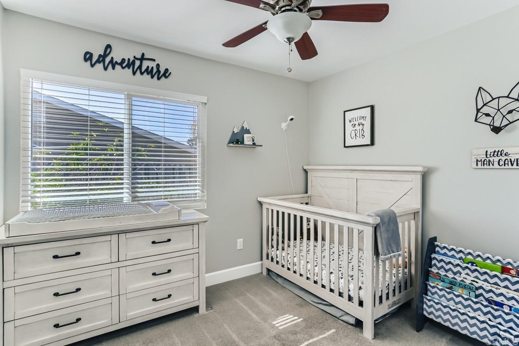 2015 Shadow Grove Way Encinitas, CA 92024 - Photo 22 of 28 a bedroom with a bed and a window