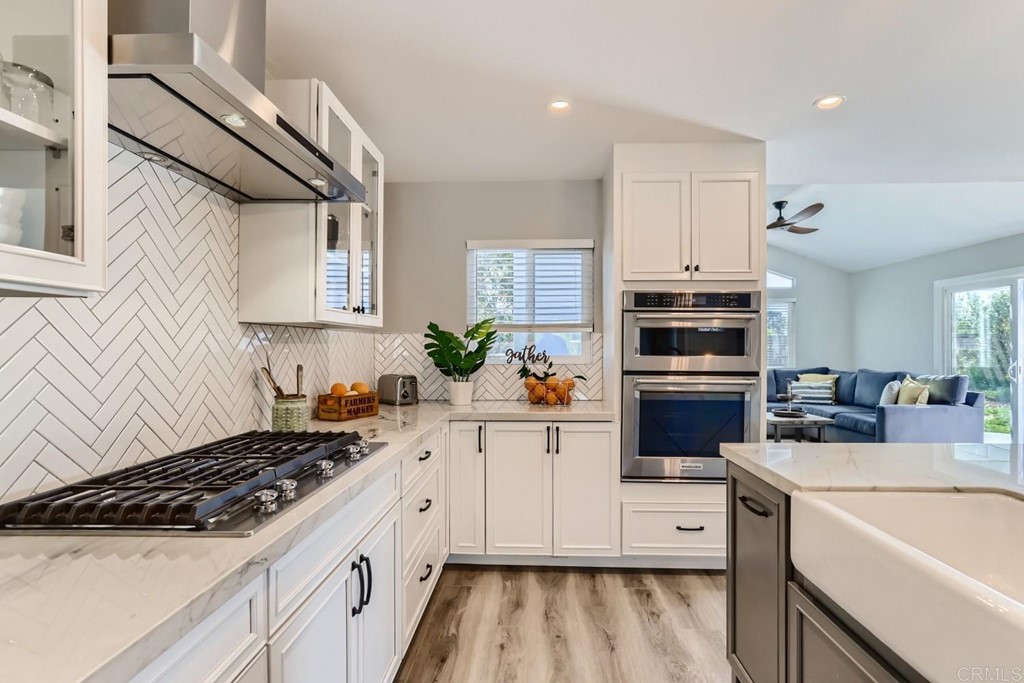 2015 Shadow Grove Way Encinitas, CA 92024 - Photo 6 of 28 a kitchen with a sink stove top oven and microwave