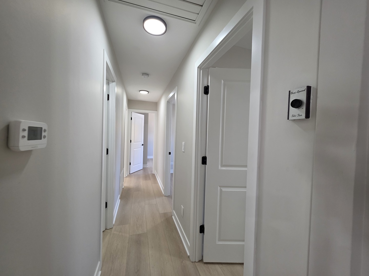 2187 Walnut Avenue Hanover Park, IL 60133 - Photo 15 of 38 a view of a hallway with wooden floor and closet