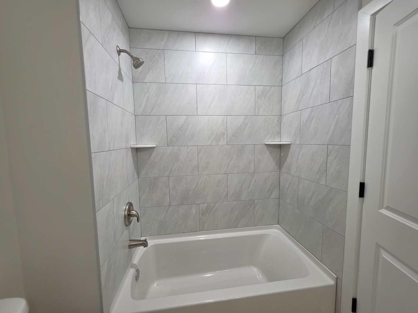 2187 Walnut Avenue Hanover Park, IL 60133 - Photo 18 of 38 a close view of a bathtub in bathroom