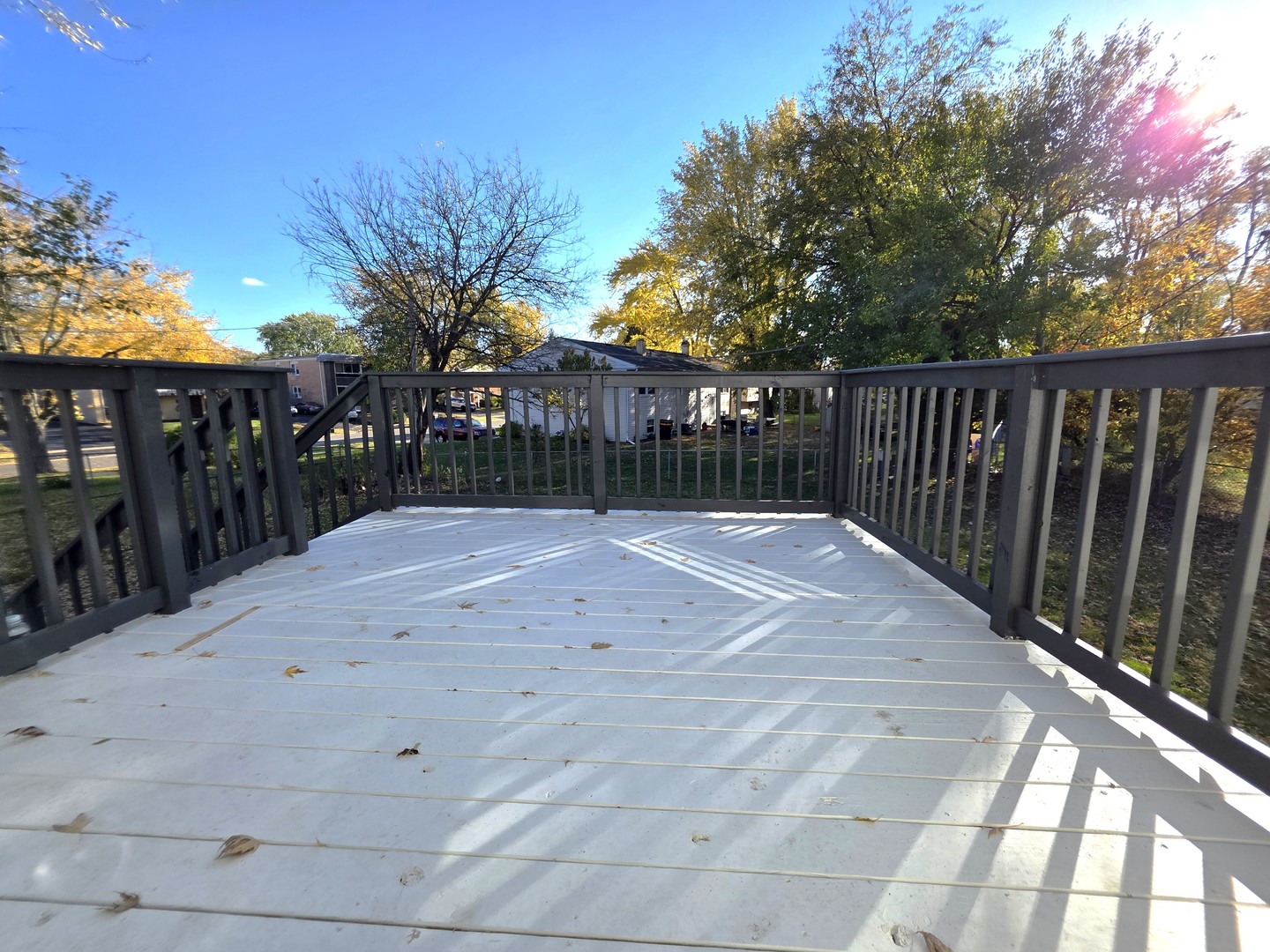 2187 Walnut Avenue Hanover Park, IL 60133 - Photo 31 of 38 a balcony with trees in front of it