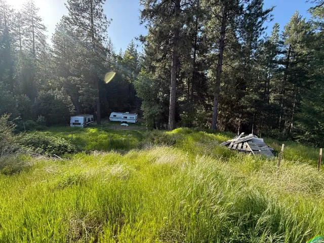 a view of a lake with a yard