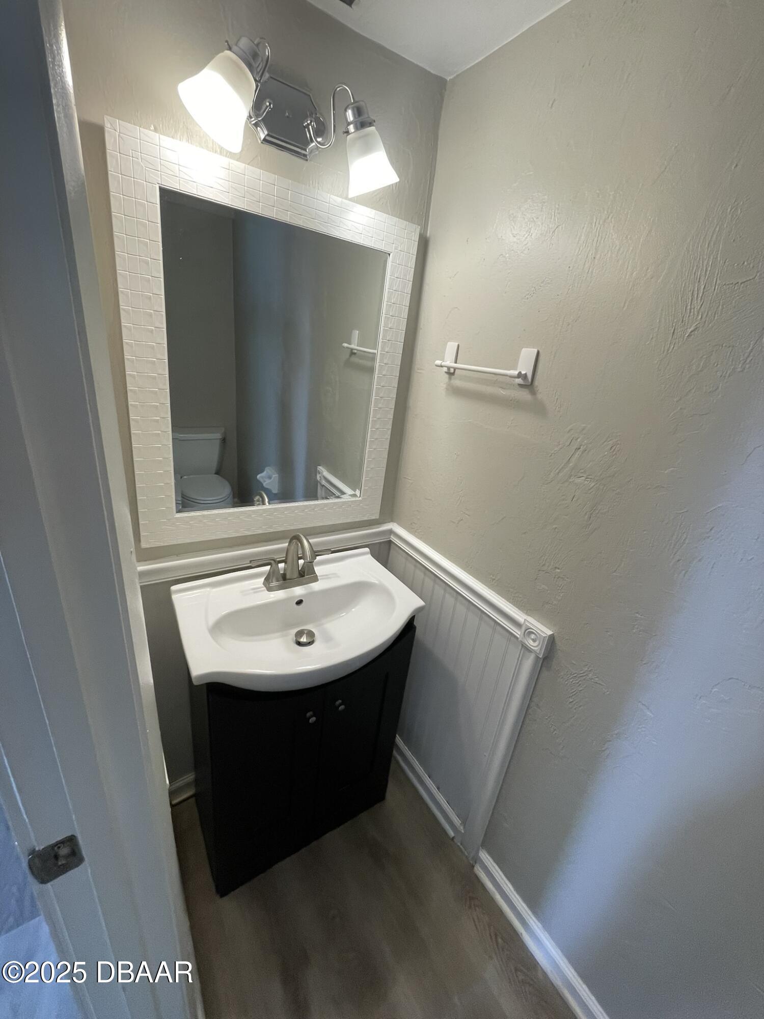97 Springwood Square Port Orange, FL 32129 - Photo 15 of 23 a bathroom with a sink and a mirror